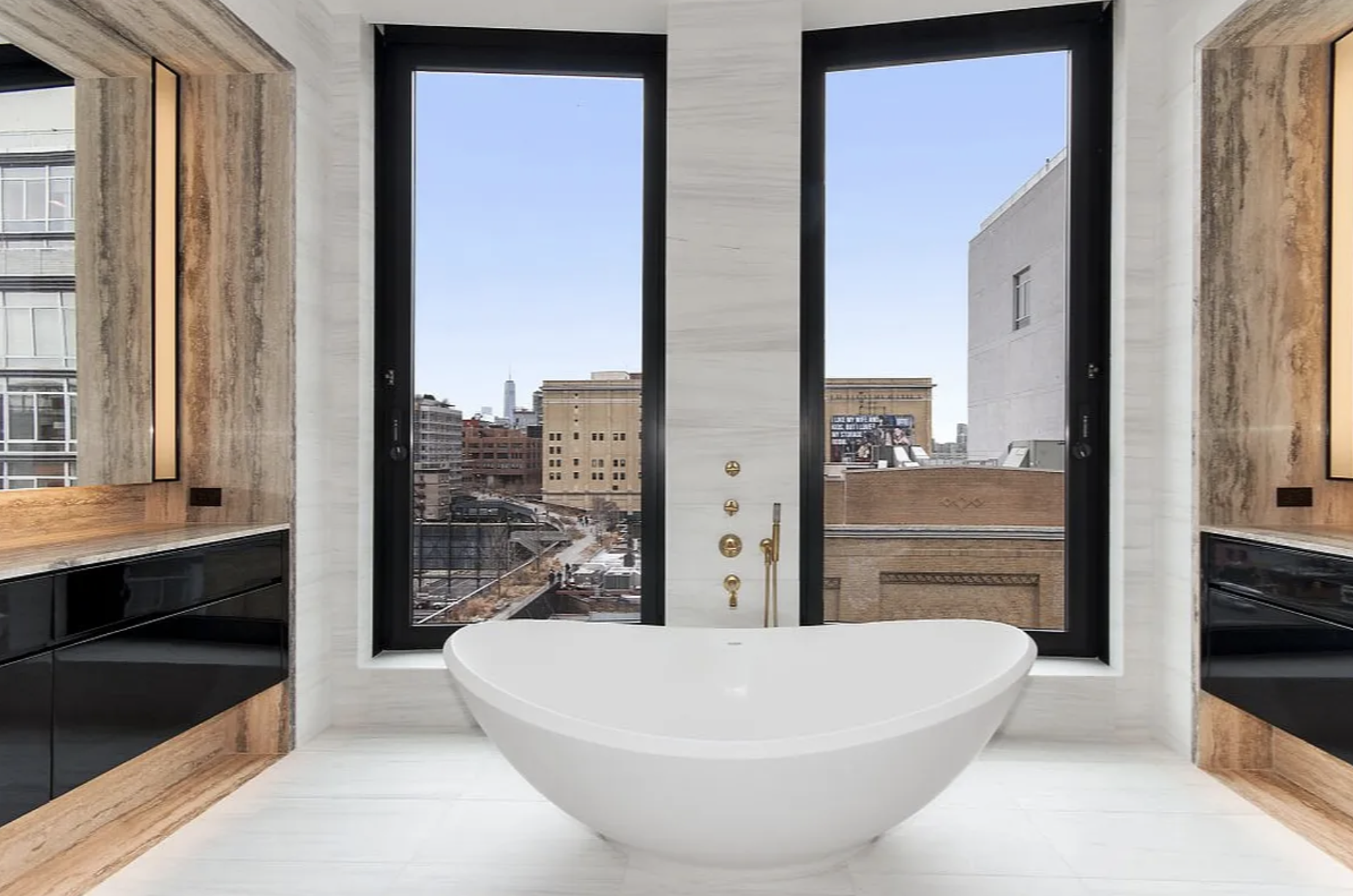 505 West 19th Street, Unit 7W Manhattan, NY 10011 - Photo 16 of 31 a white bath tub sitting next to a window