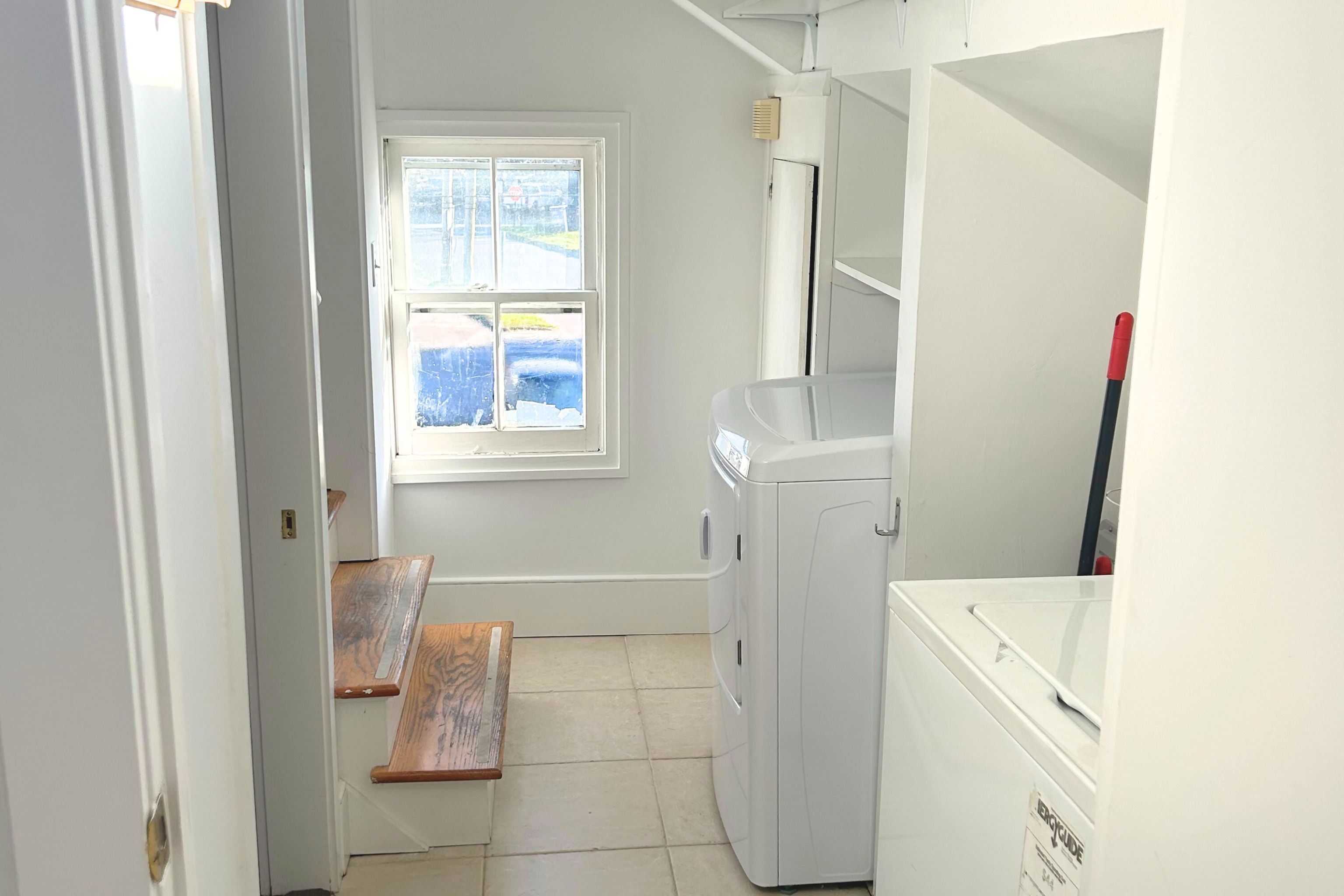 23 Bridge Street Sag Harbor, NY 11963 - Photo 19 of 25 a bathroom with a sink and a mirror
