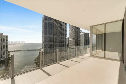 a balcony with a glass door