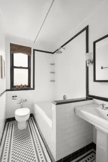 a bathroom with a sink toilet a mirror and vanity