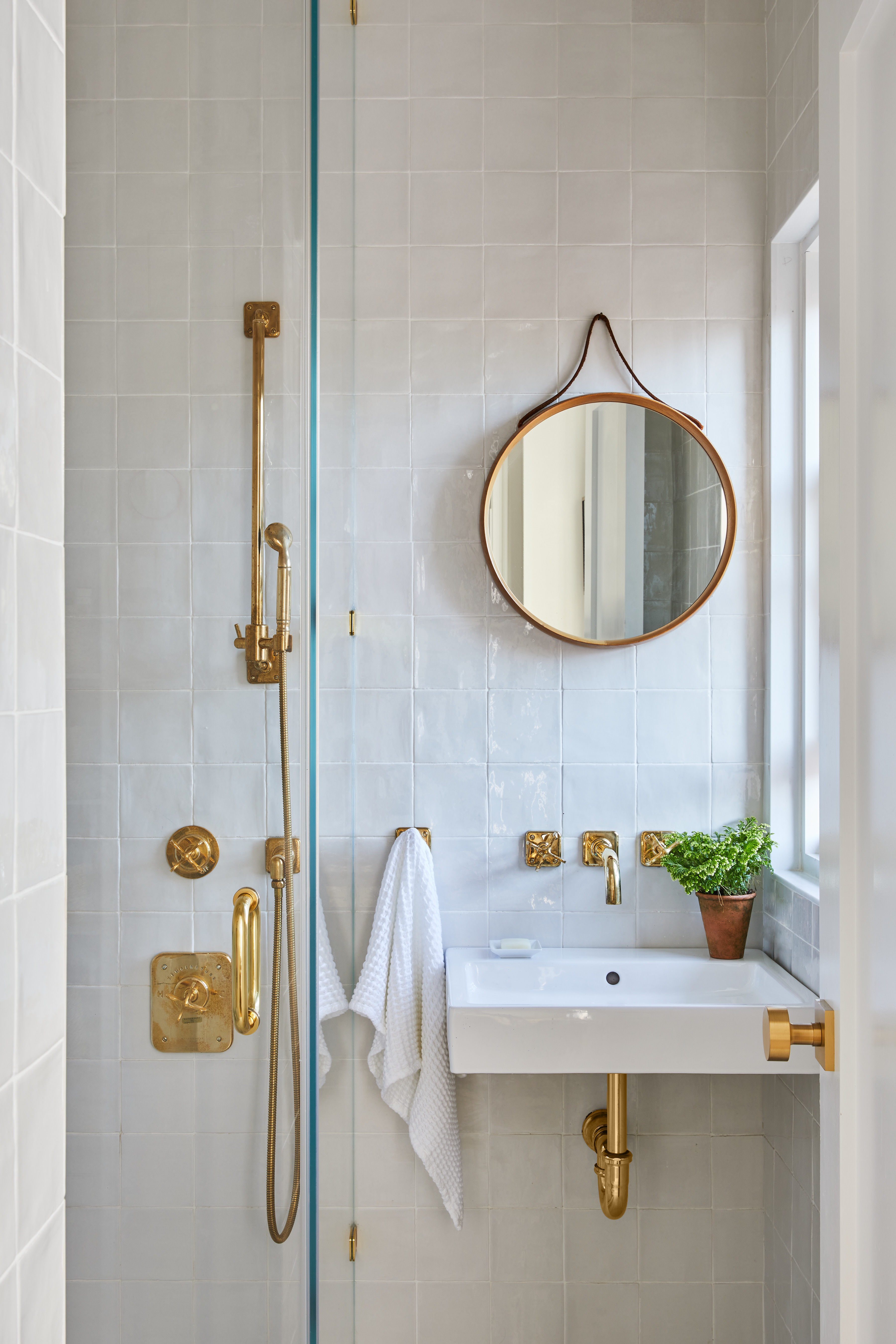 30 5th Avenue, Unit 16H Manhattan, NY 10011 - Photo 10 of 15 a bathroom with a sink and a mirror