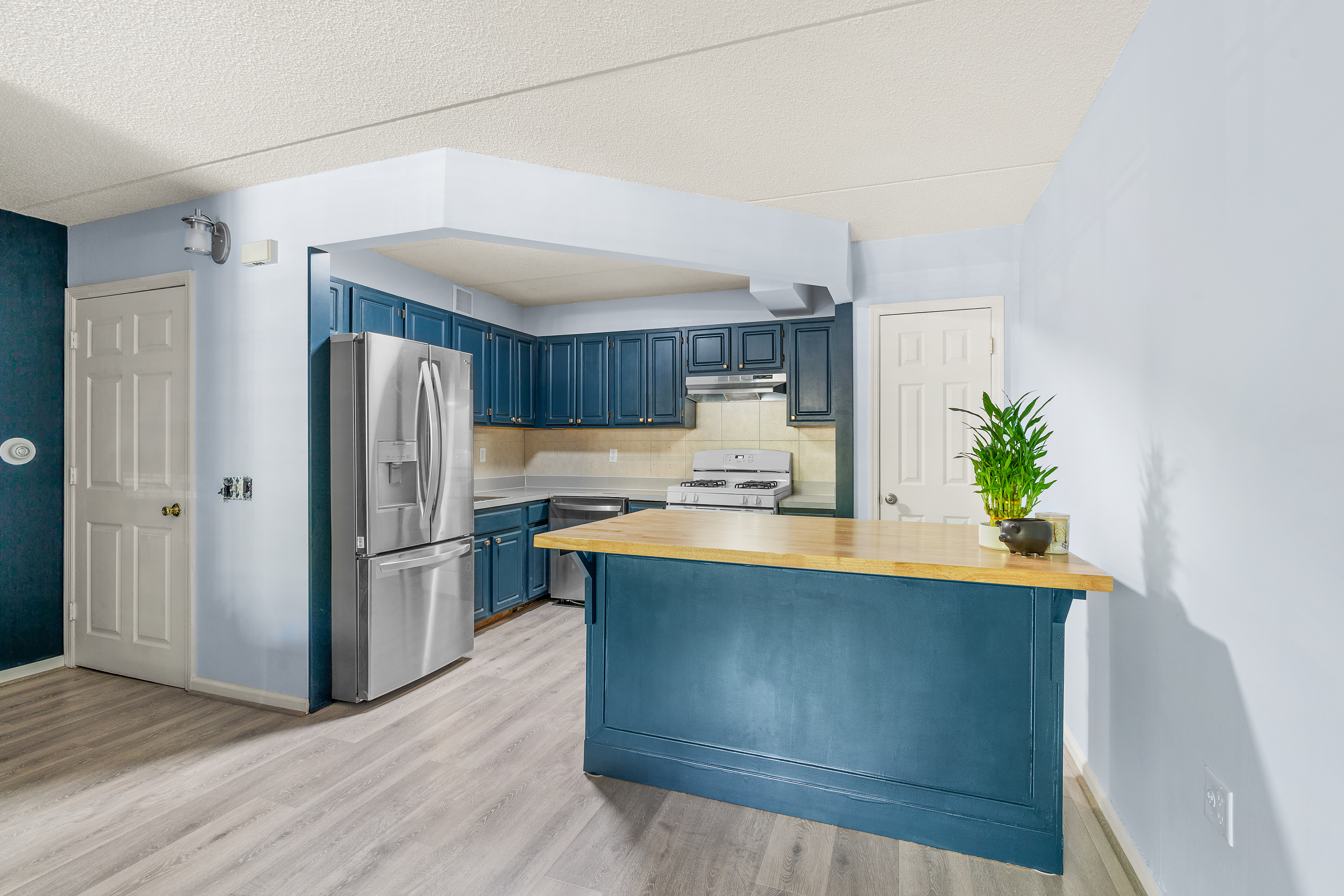482 Central Avenue, Unit 1 Brooklyn, NY 11221 - Photo 2 of 6 a kitchen with stainless steel appliances granite countertop a refrigerator a sink and a stove