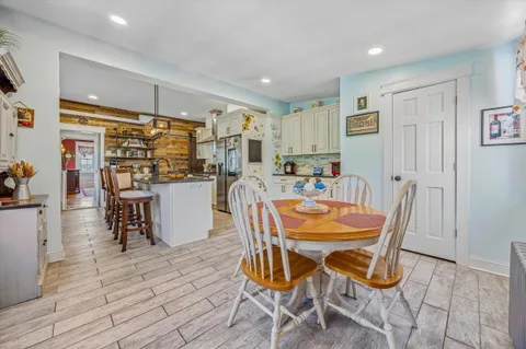 a dining room dining table chairs and view kitchen
