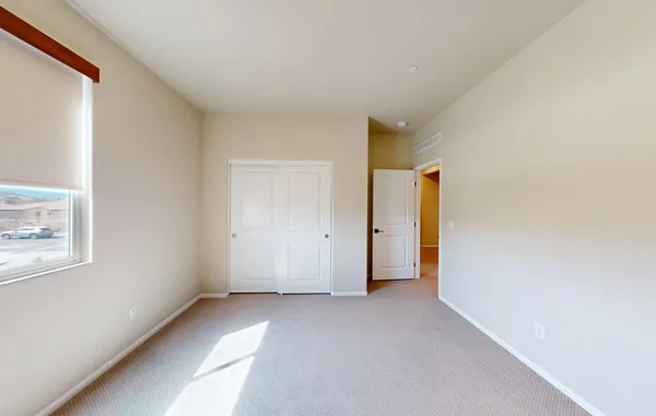 a outdoor living space with patio furniture and a flat screen tv