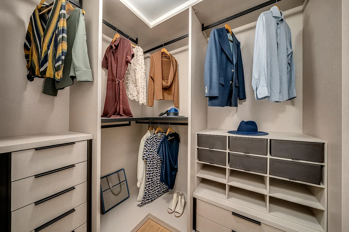 139 East 23rd Street, Unit 7 Manhattan, NY 10010 - Photo 9 of 17 a view of walk in closet with clothes and shoes