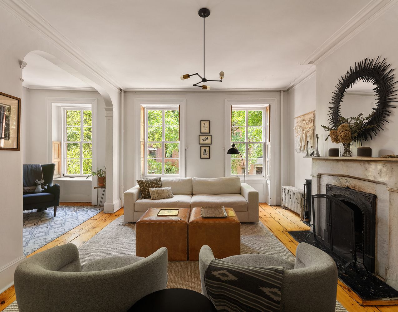 a kitchen with stainless steel appliances granite countertop a refrigerator a stove top oven a sink and dishwasher with wooden floor