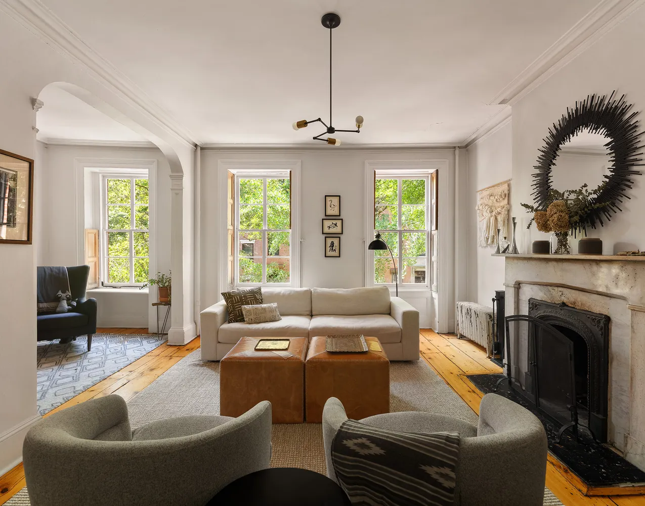 a kitchen with stainless steel appliances granite countertop a refrigerator a stove top oven a sink and dishwasher with wooden floor