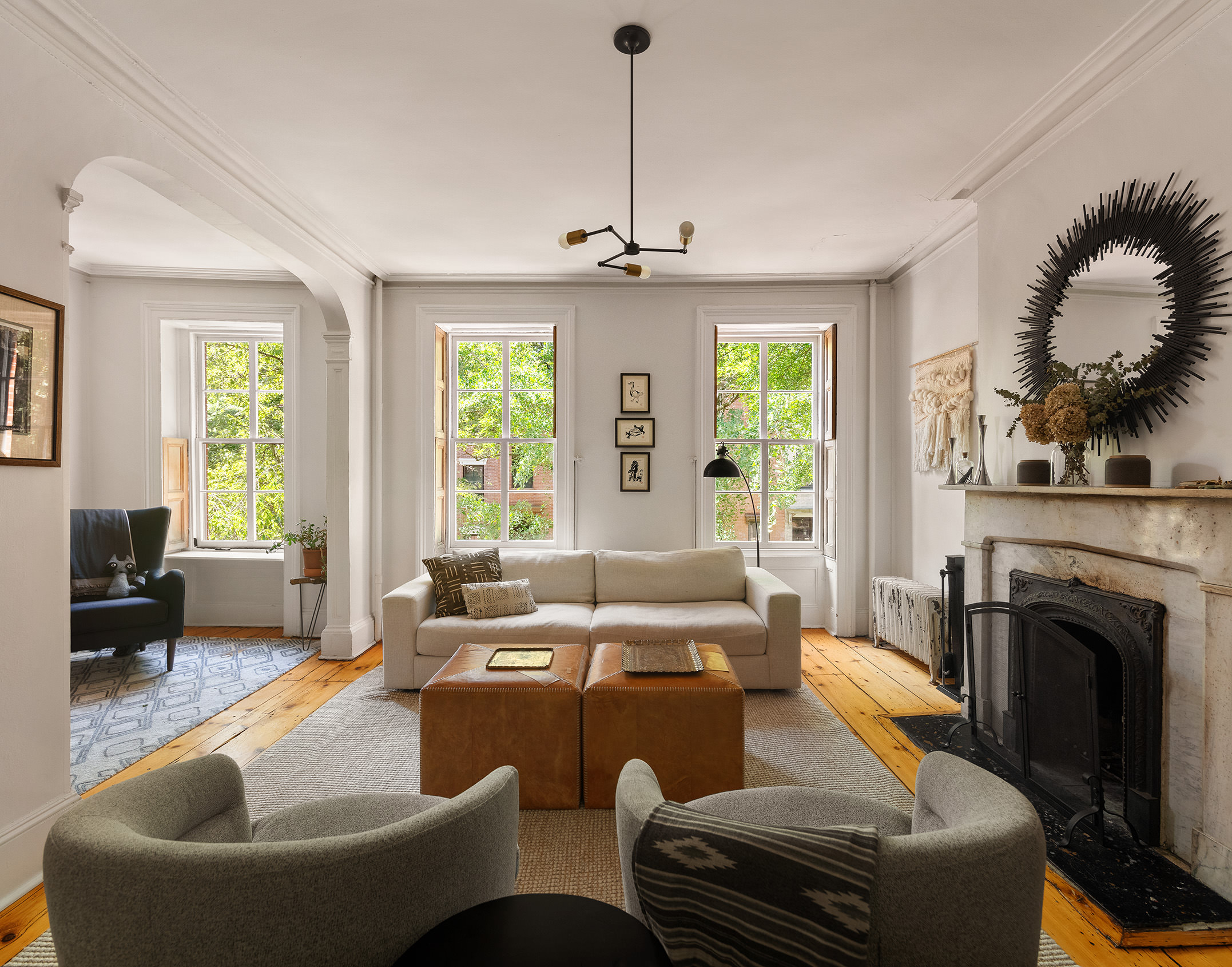 433 Pacific Street Brooklyn, NY 11217 - Photo 17 of 22 a living room with furniture a fireplace and a chandelier