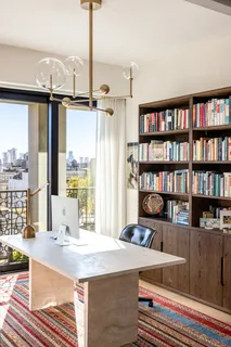a room with furniture and a book shelf