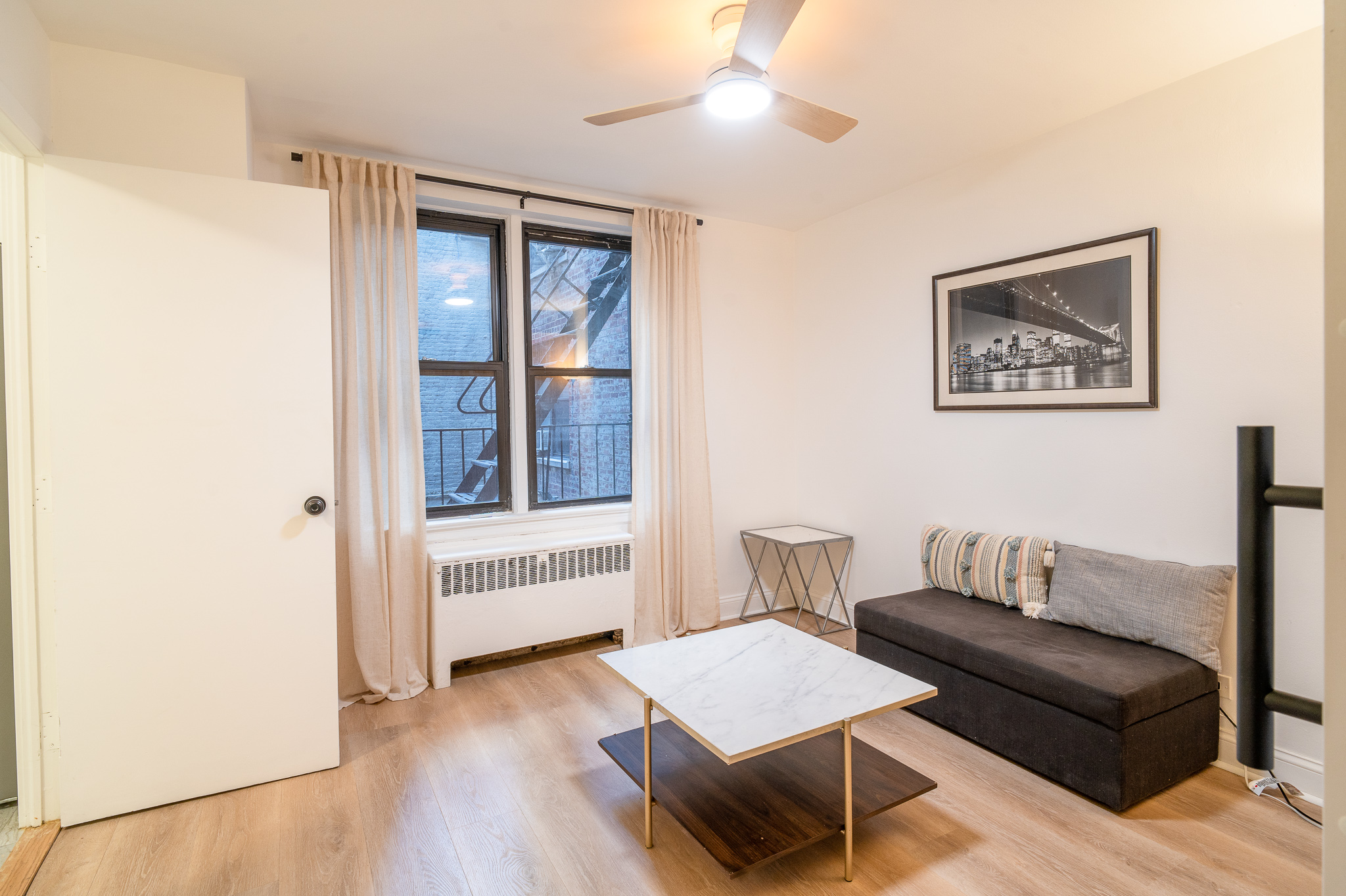 a living room with furniture and a window