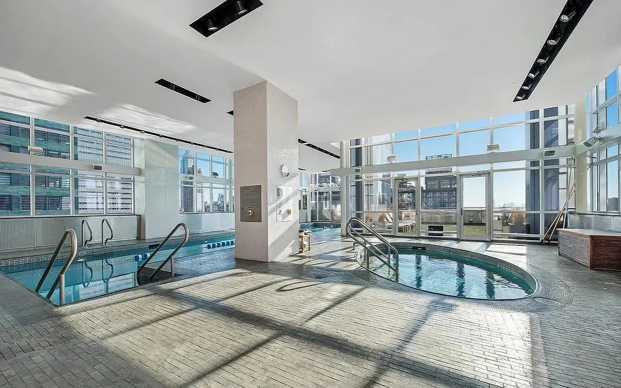 a view of a livingroom with furniture and a window