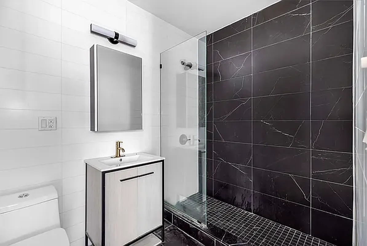18 A Bleecker Street, Unit 1A Brooklyn, NY 11221 - Photo 5 of 6 a bathroom with a sink toilet and shower
