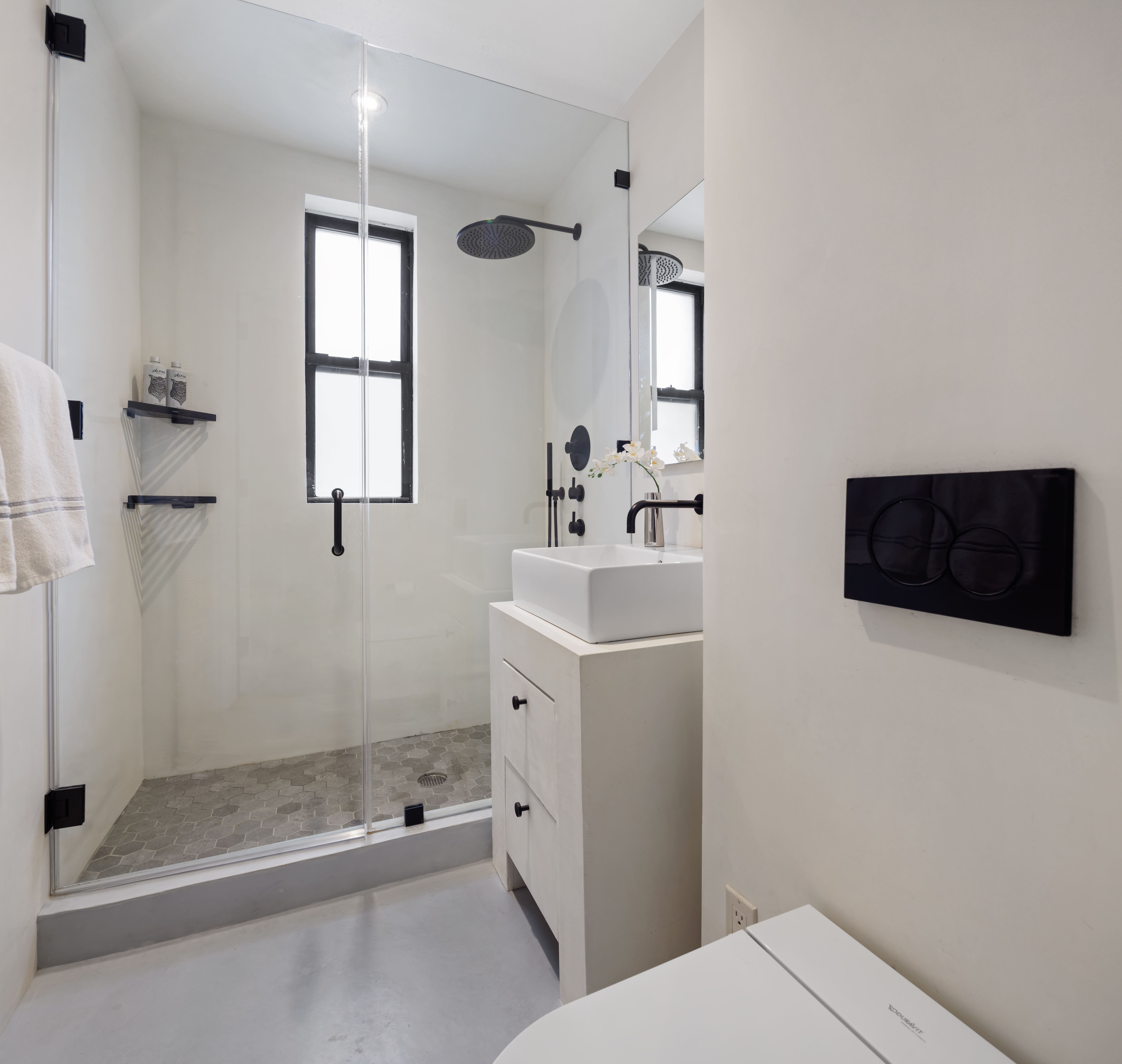 45 5th Avenue, Unit 15CD Manhattan, NY 10003 - Photo 8 of 14 a bathroom with a toilet a sink and shower
