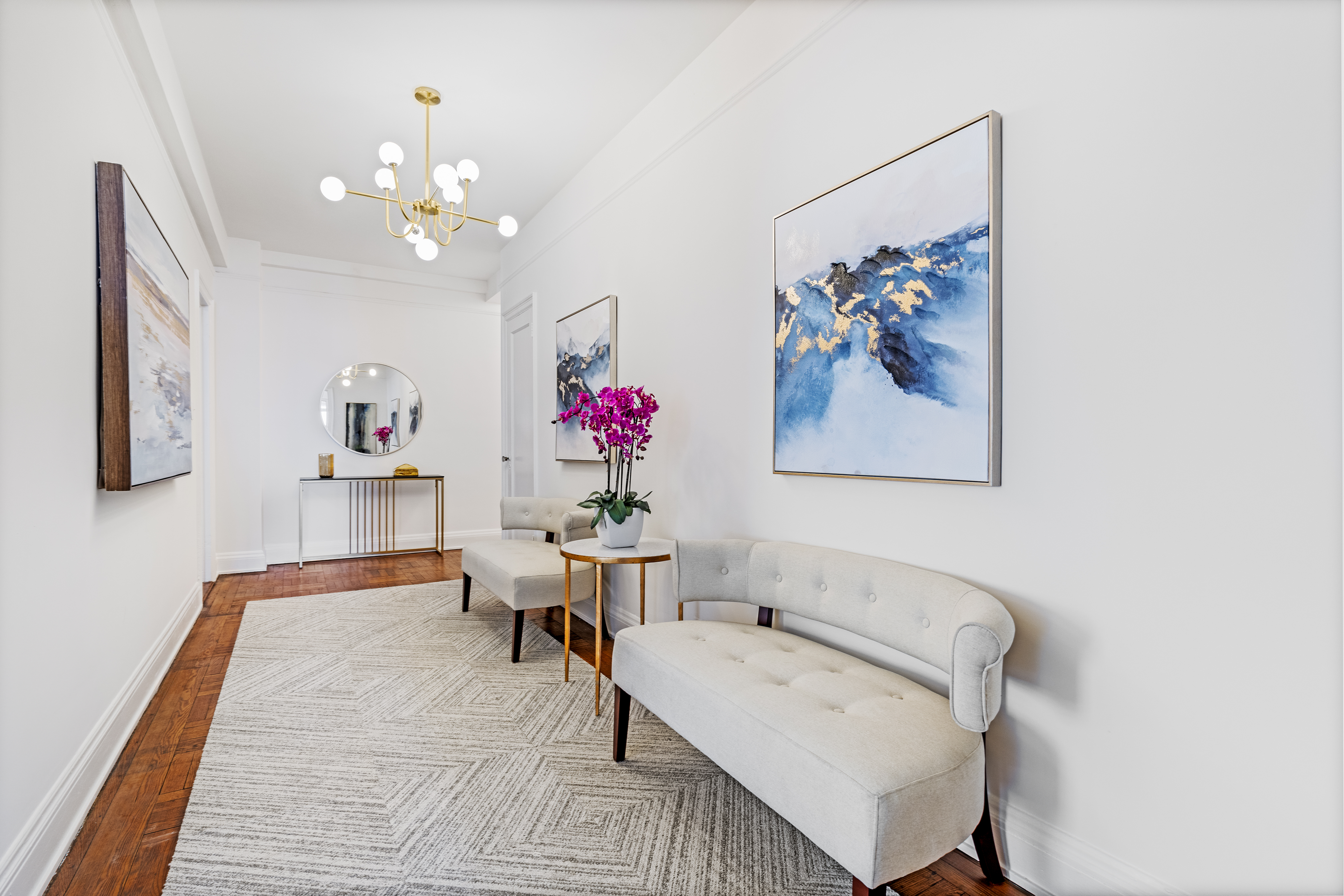 320 Riverside Drive, Unit 10G Manhattan, NY 10025 - Photo 9 of 16 a living room with furniture and a chandelier