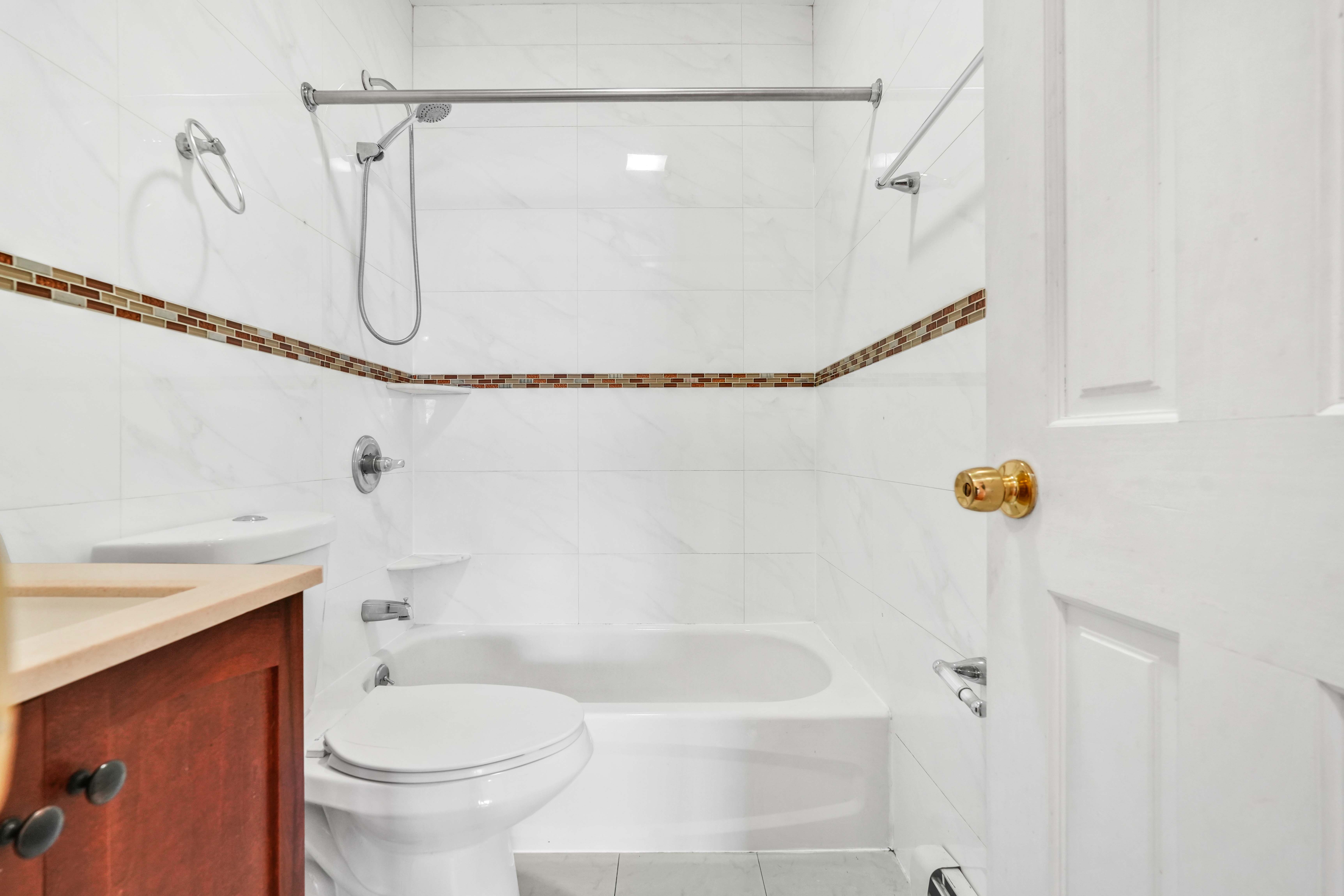 1892 Bergen Street, Unit 2 Brooklyn, NY 11233 - Photo 14 of 24 a bathroom with a shower a toilet and a sink