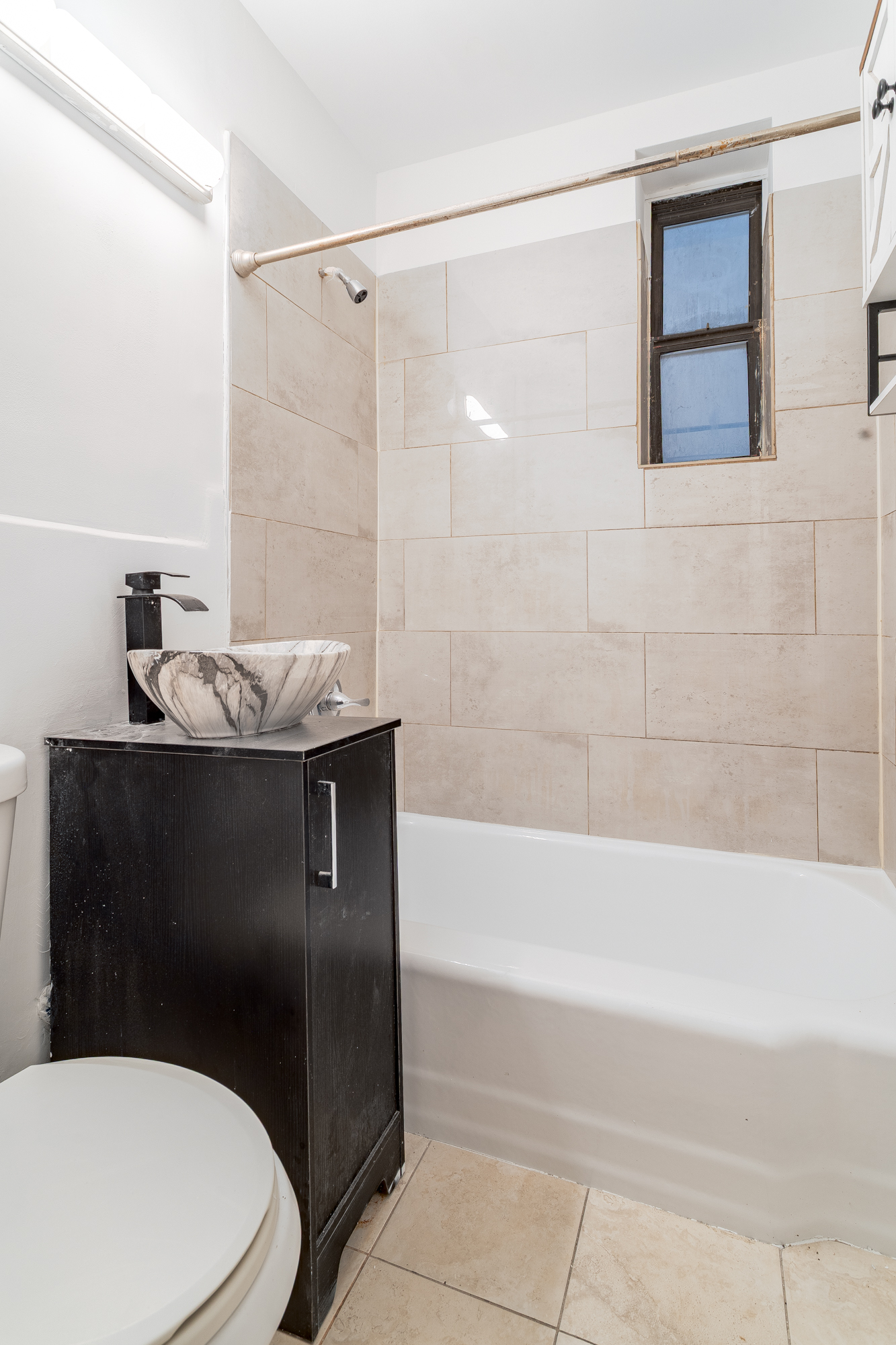 157 West 123rd Street, Unit 2A Manhattan, NY 10027 - Photo 13 of 16 a bathroom with a granite countertop sink toilet and shower