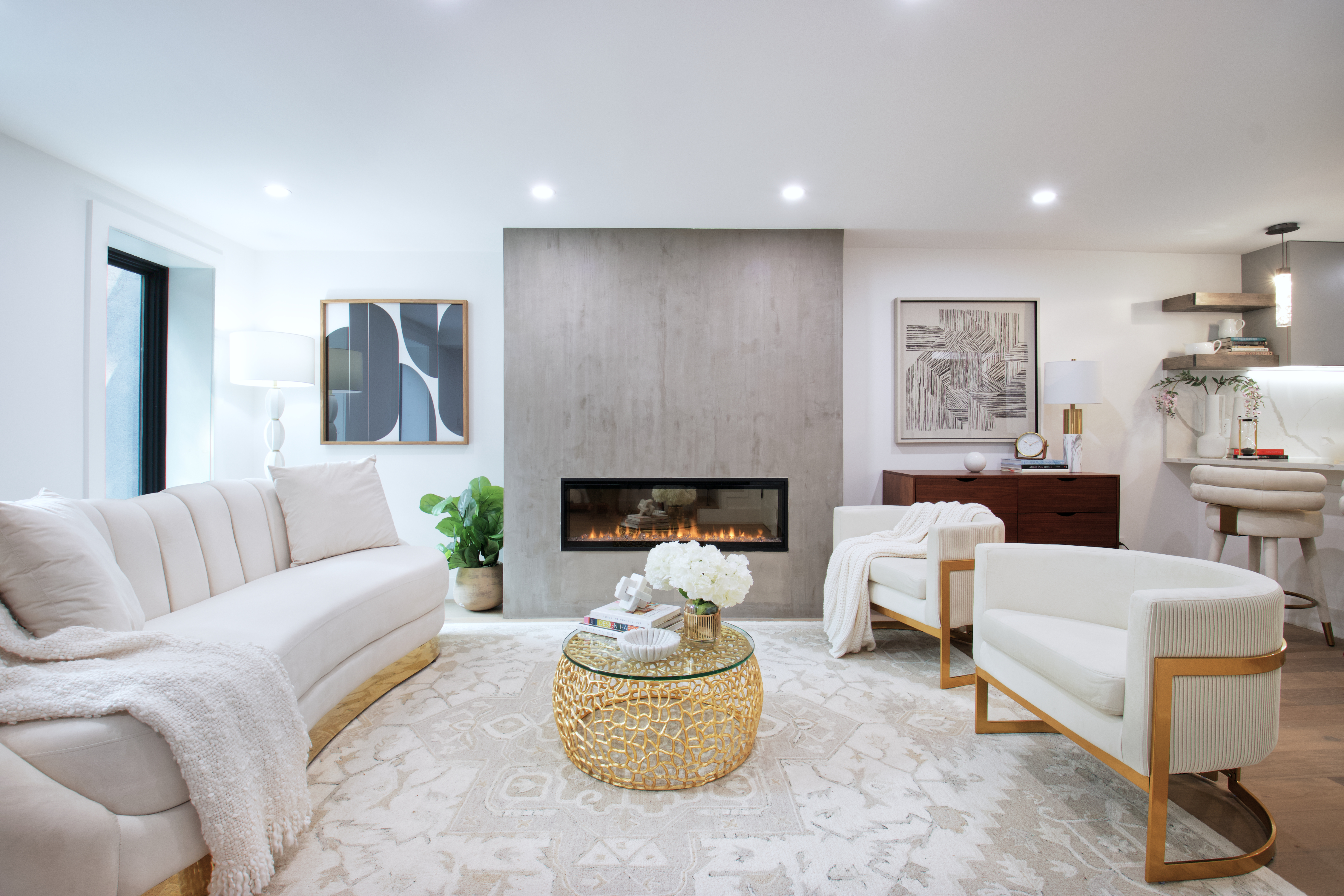 a living room with furniture and a fireplace