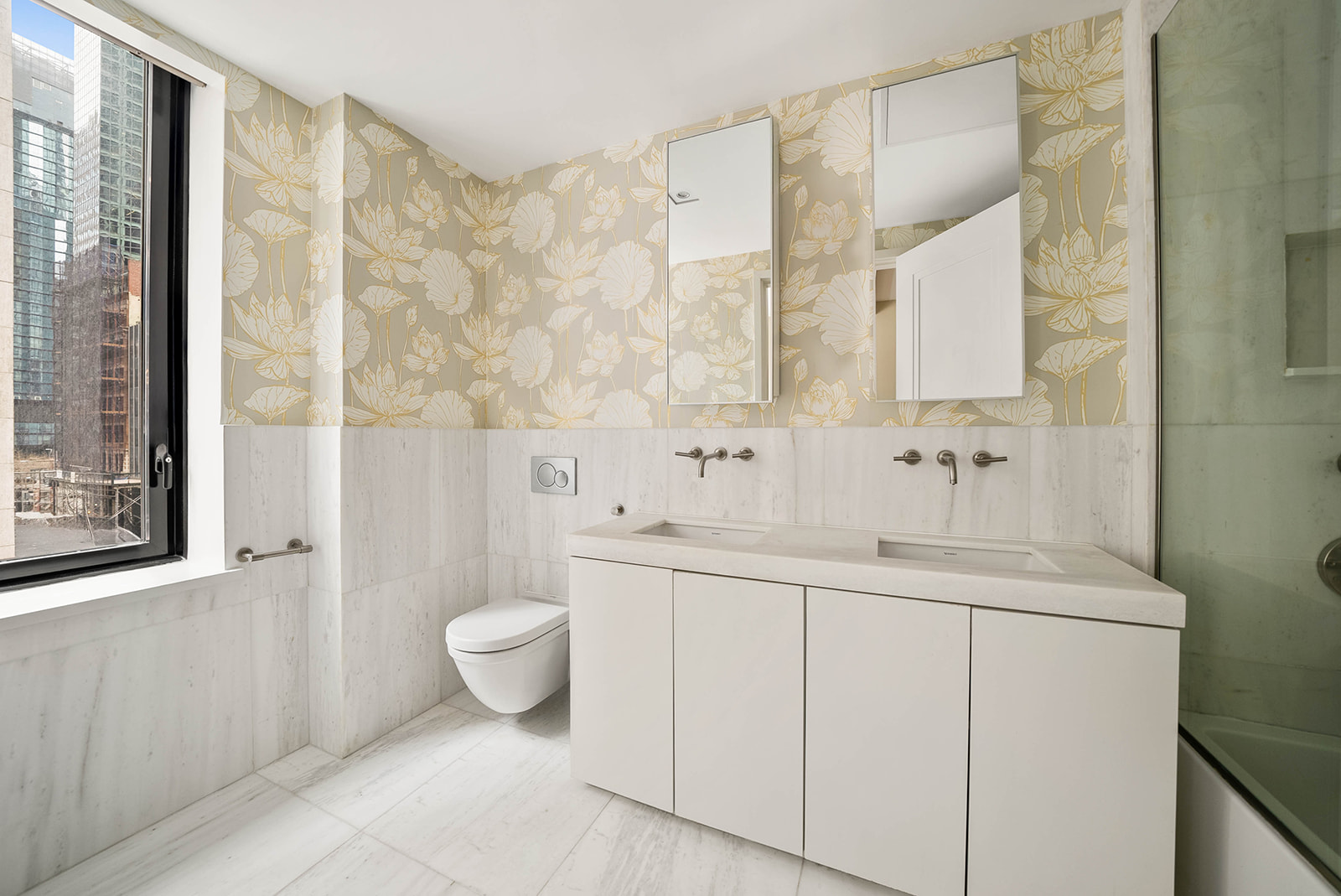 101 Wall Street, Unit 4B Manhattan, NY 10005 - Photo 7 of 20 a bathroom with a sink a toilet and shower