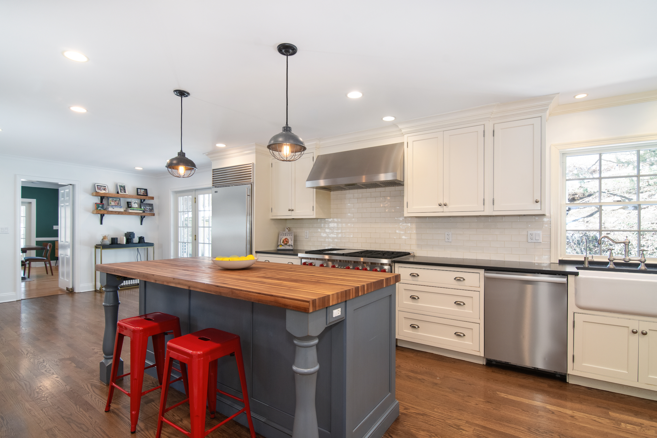 41 Harris Road Katonah, NY 10536 - Photo 3 of 48 a kitchen with stainless steel appliances granite countertop a sink a stove and a wooden floors