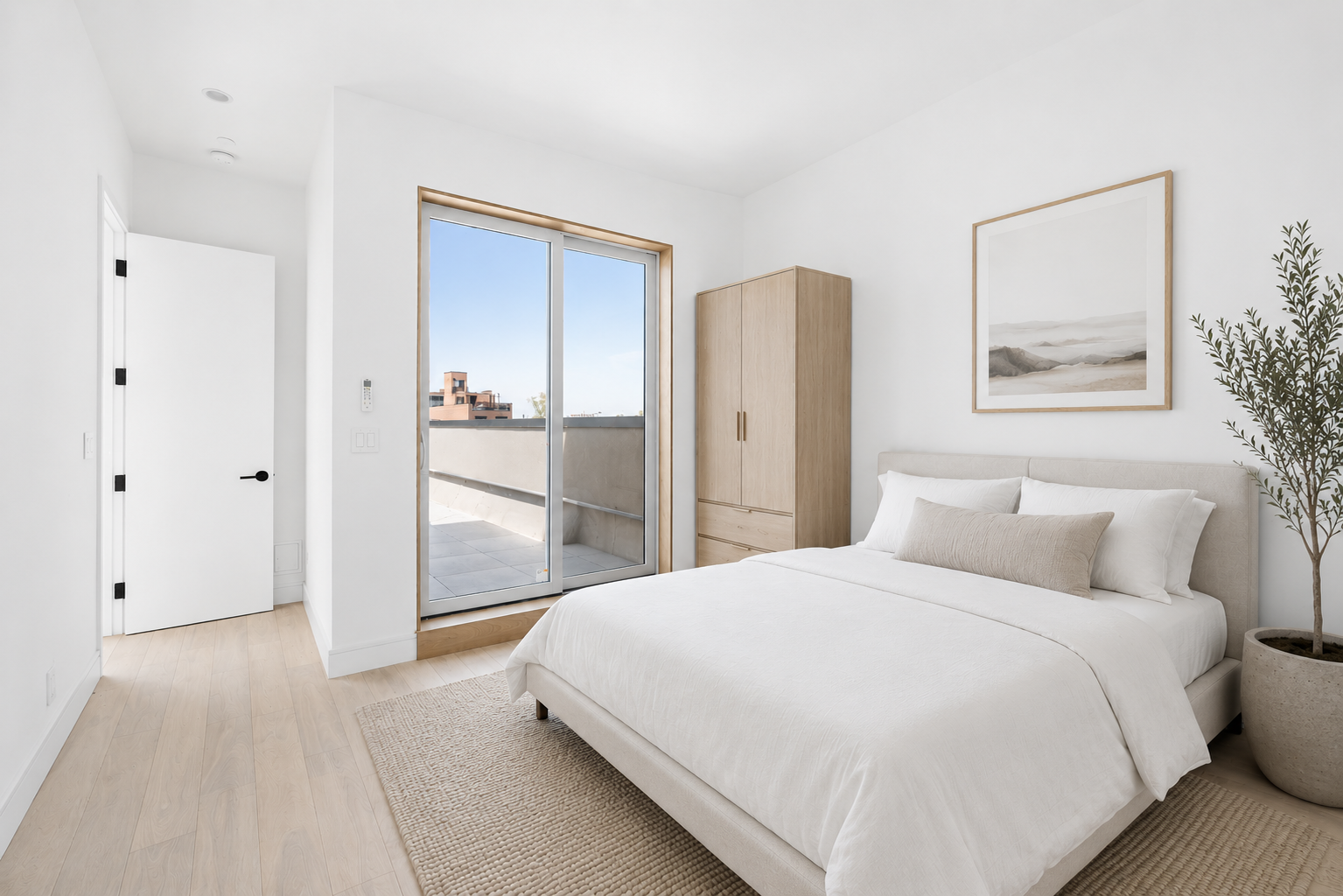 810 Sterling Place, Unit PH Brooklyn, NY 11216 - Photo 10 of 16 a bedroom with a bed and a painting on the wall