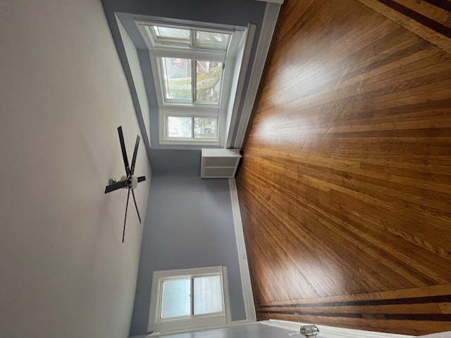340 Marlborough Road Brooklyn, NY 11226 - Photo 18 of 27 wooden floor in an empty room with a window