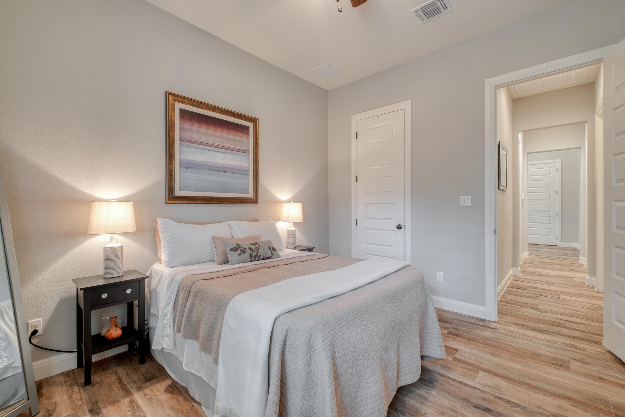 3836 Kyler Glen Road Round Rock, TX 78681 - Photo 30 of 41 a bedroom with a bed and a painting on the wall