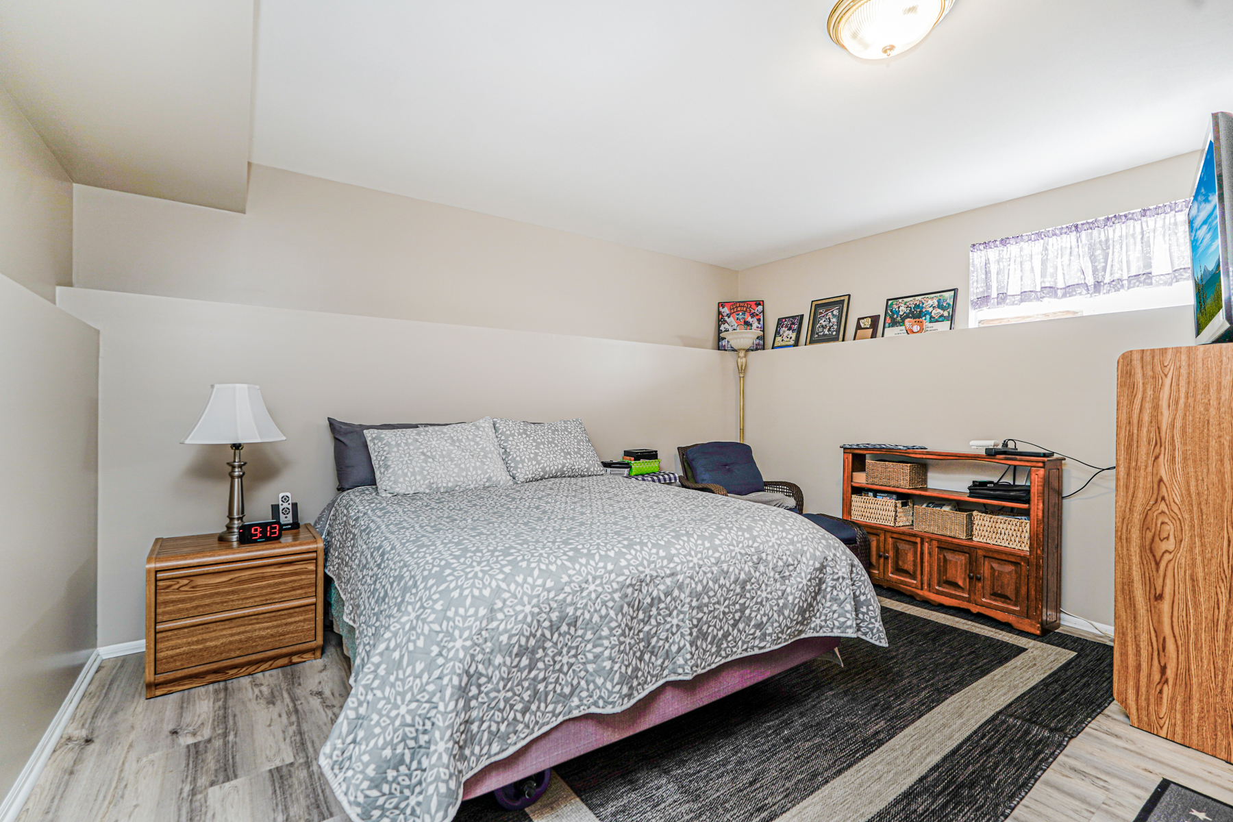 287 Greaves Avenue Staten Island, NY 10308 - Photo 24 of 35 a bedroom with a bed and wooden floor