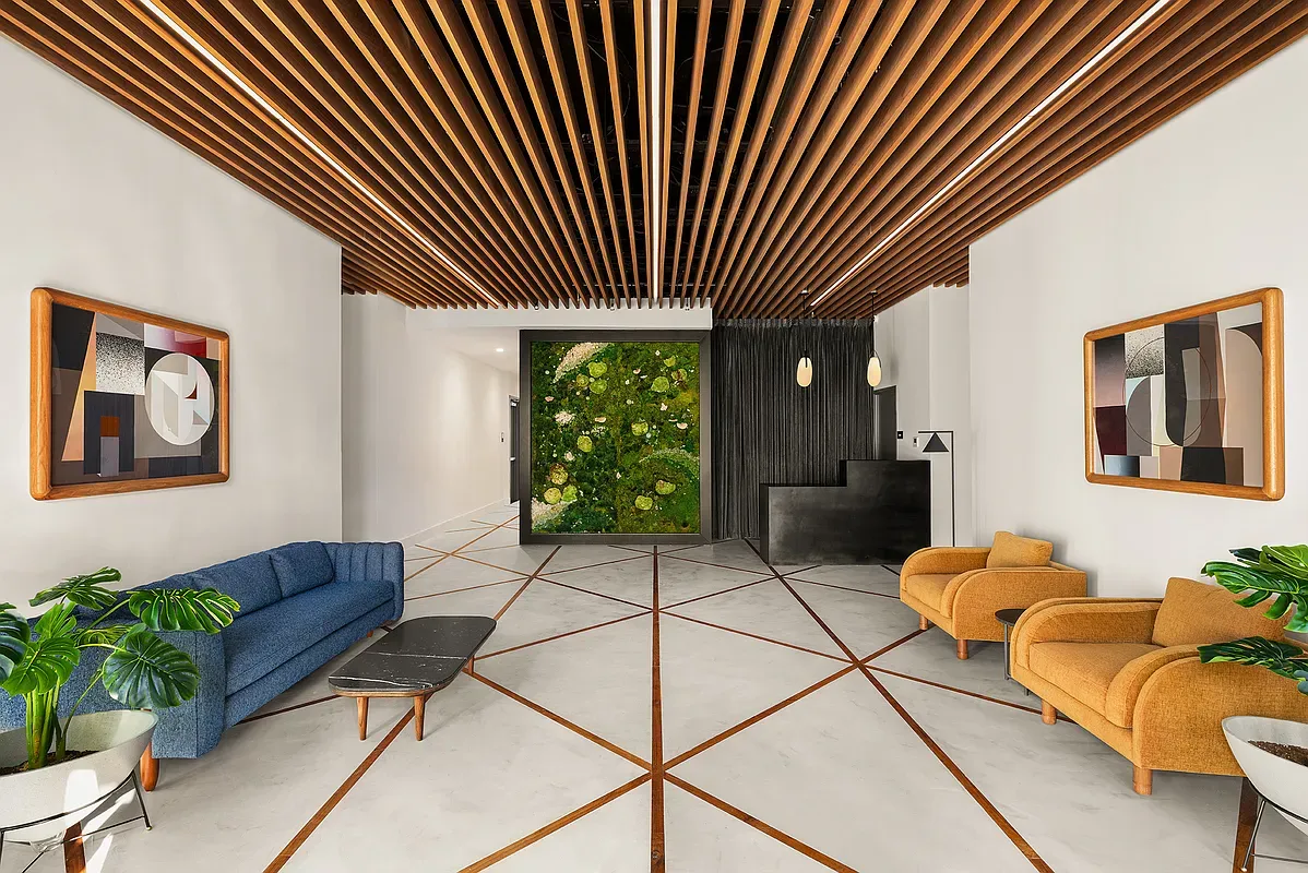 a living room with furniture and a potted plant