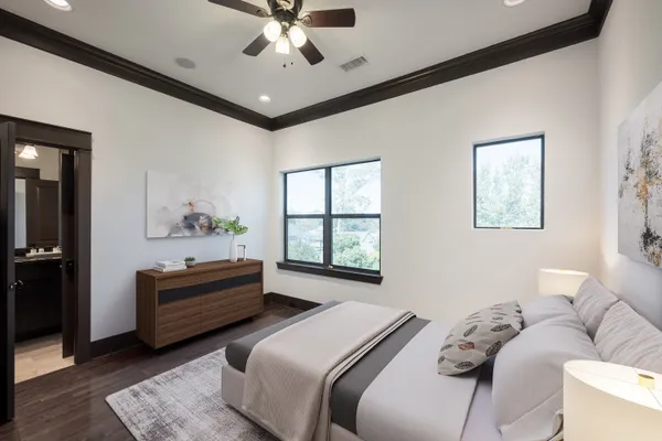 a bedroom with a bed couch and window