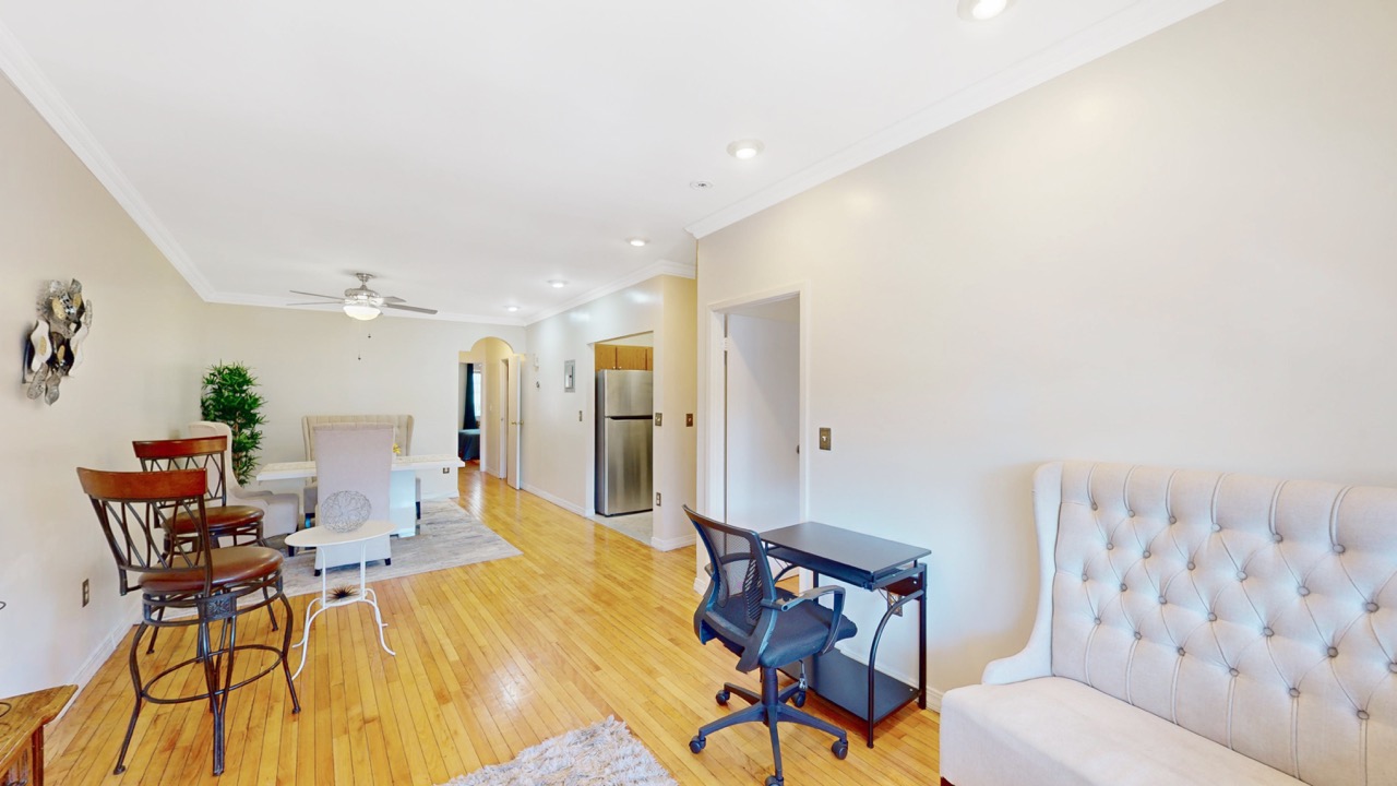 495 Central Avenue, Unit 2 Brooklyn, NY 11221 - Photo 3 of 19 a view of a dining room with furniture and wooden floor