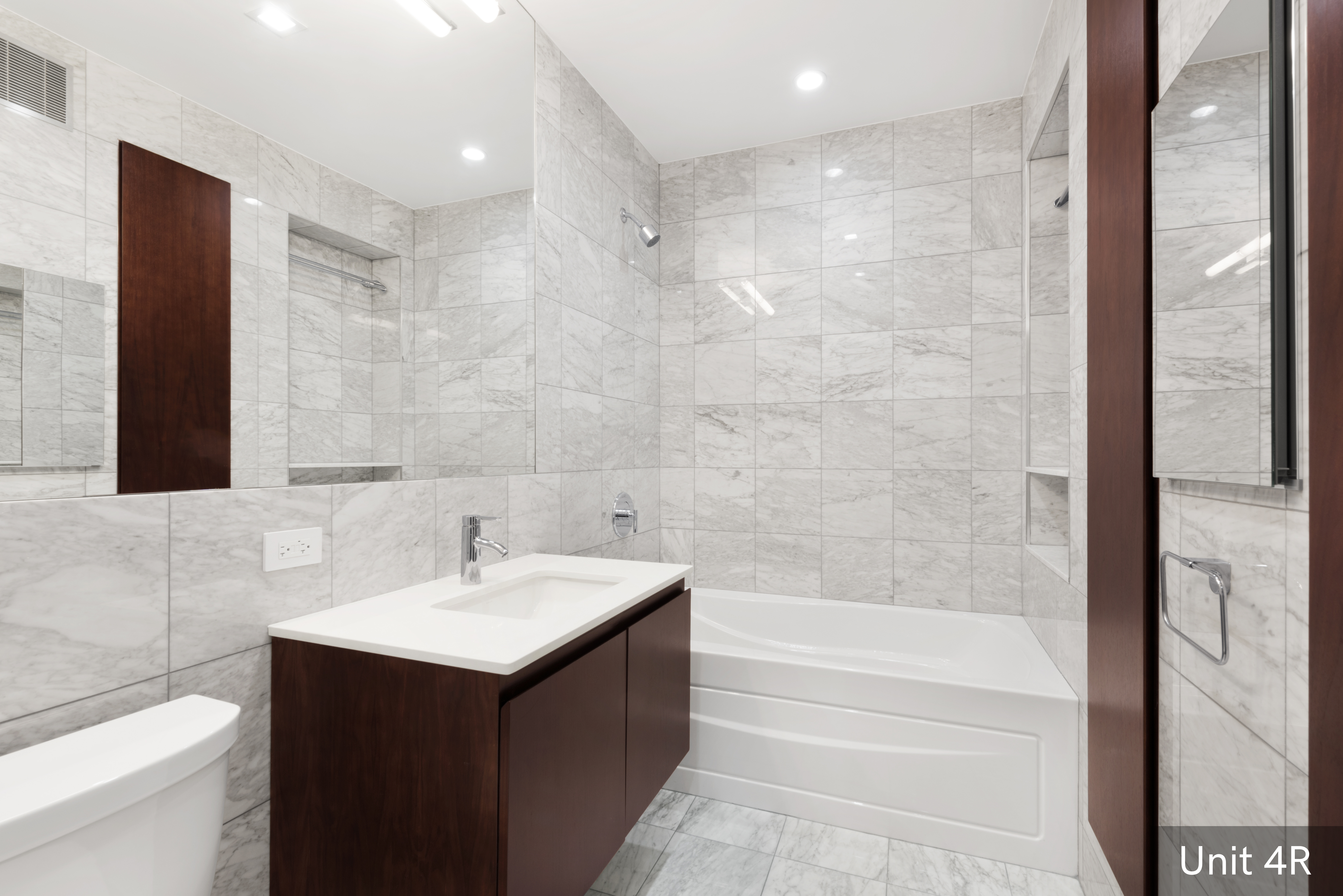 120 East 19th Street Manhattan, NY 10003 - Photo 28 of 33 a bathroom with a sink and a mirror