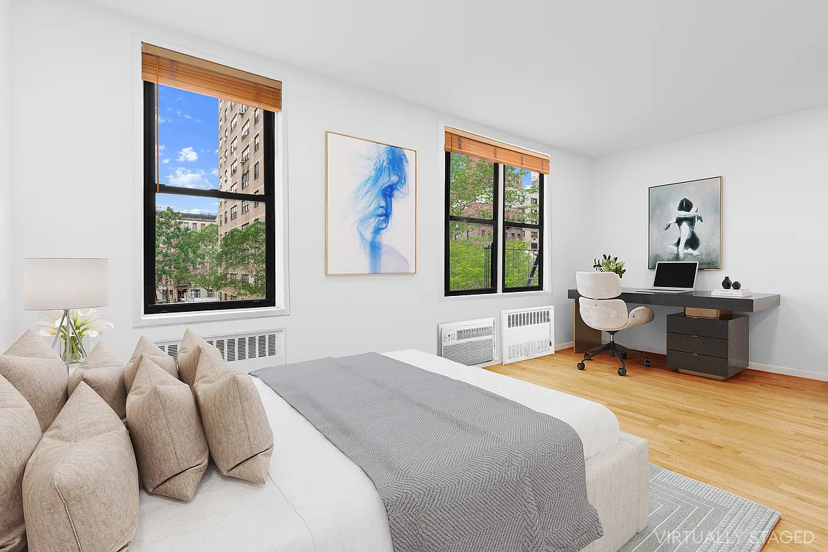 229 East 28th Street, Unit 3D Manhattan, NY 10016 - Photo 2 of 7 a bedroom with a bed and a window