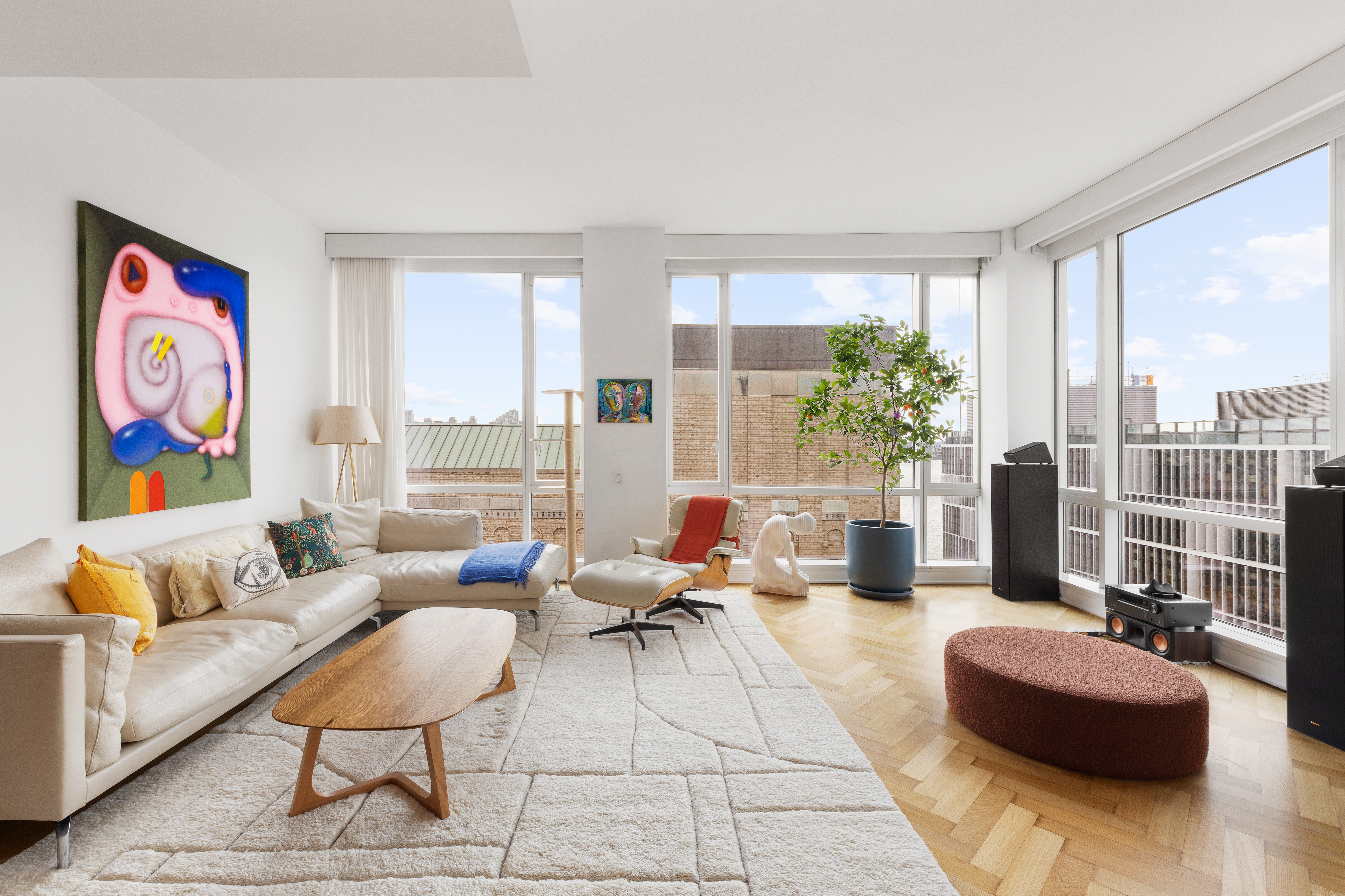 330 Spring Street, Unit 11B Manhattan, NY 10013 - Photo 2 of 10 a living room with furniture and a potted plant