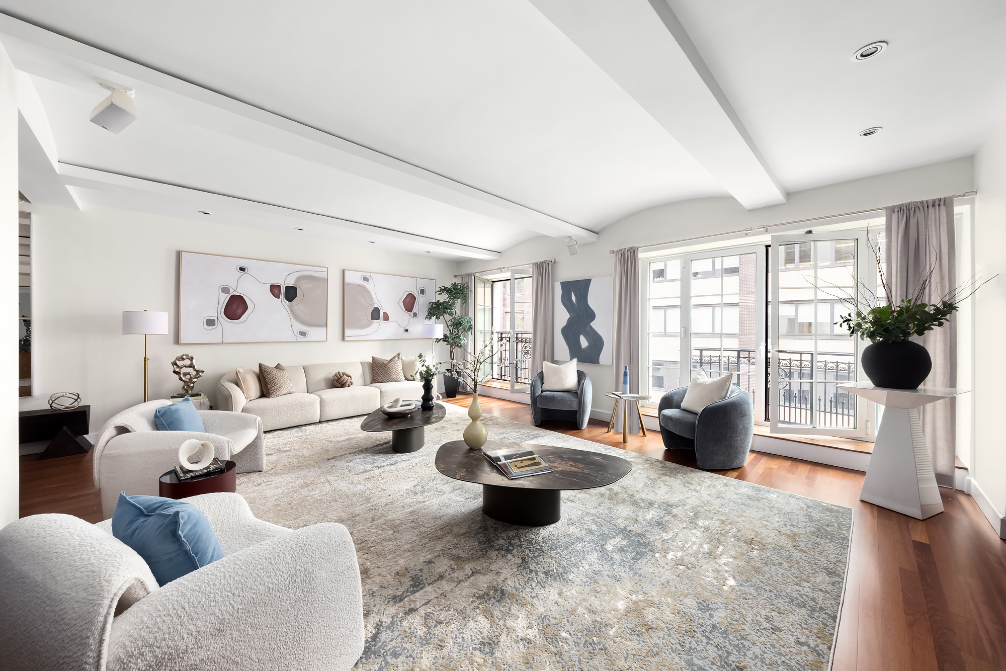 43 West 64th Street, Unit 7A Manhattan, NY 10023 - Photo 1 of 20 a living room with furniture and a large window
