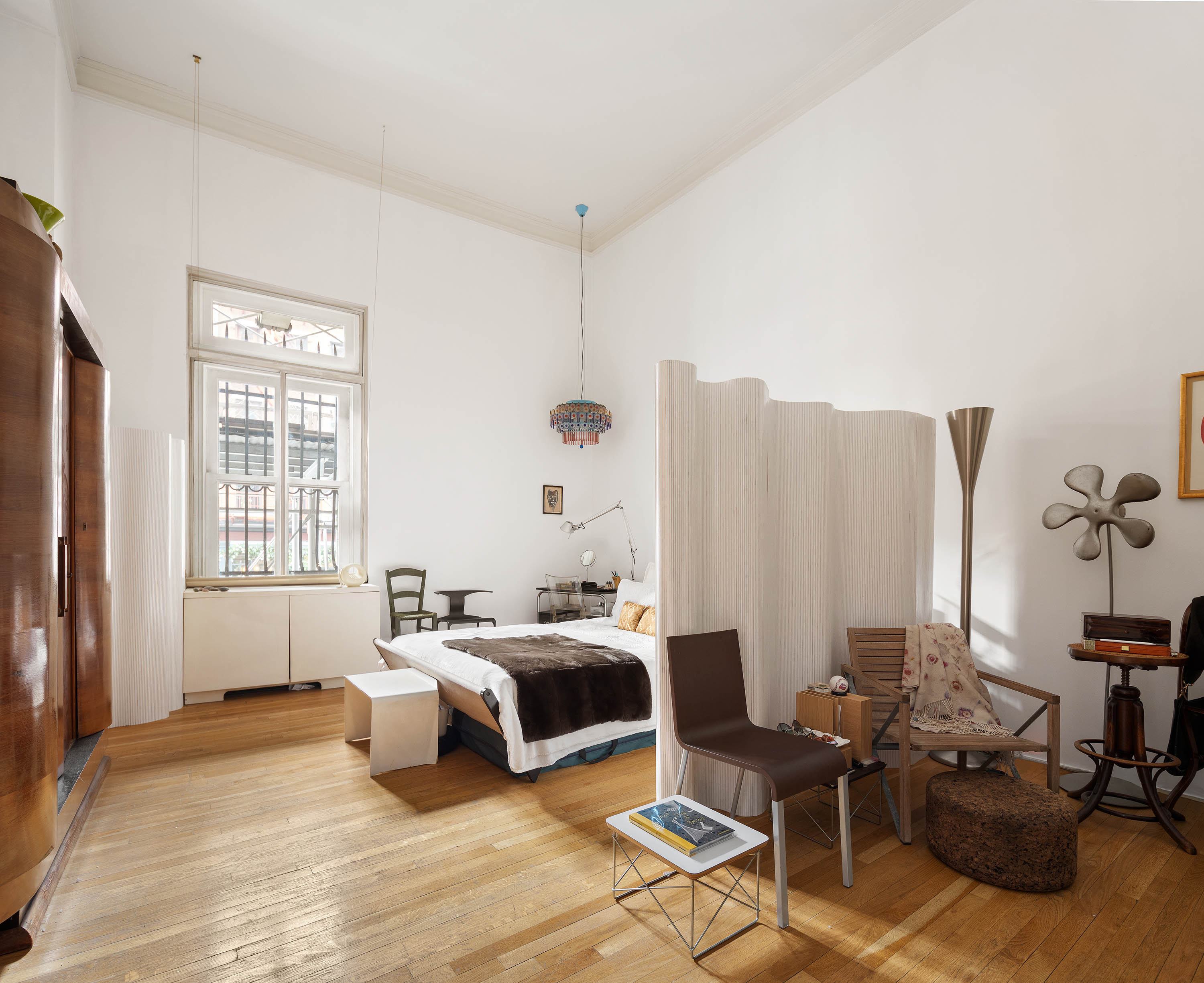 240 Centre Street, Unit 2B Manhattan, NY 10013 - Photo 5 of 12 a bedroom with furniture and a window