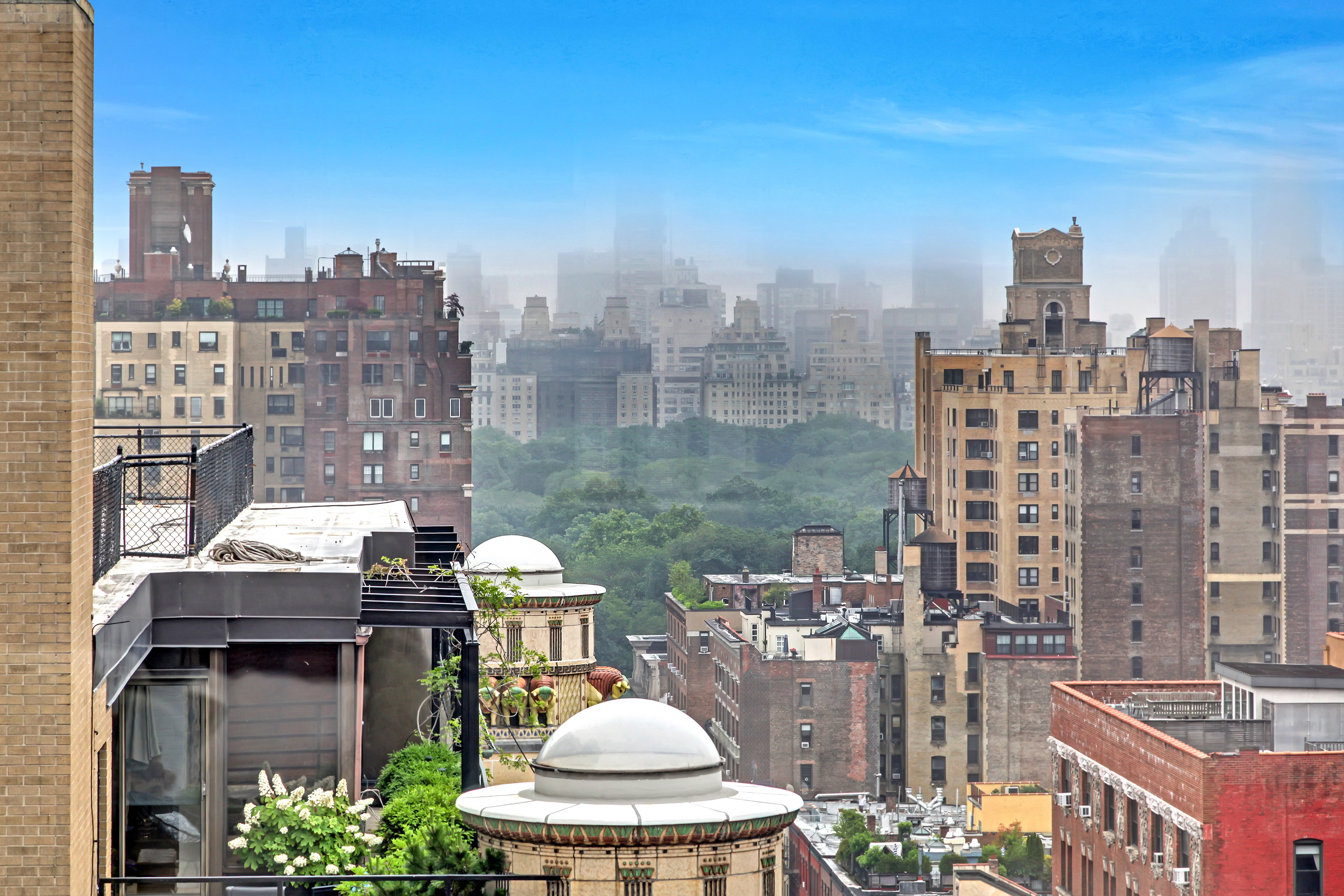 155 West 70th Street, Unit PH4A Manhattan, NY 10023 - Photo 2 of 6 a balcony with table and chairs