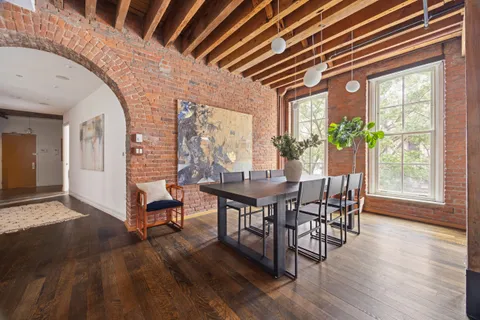 a dining room with furniture window wooden floor