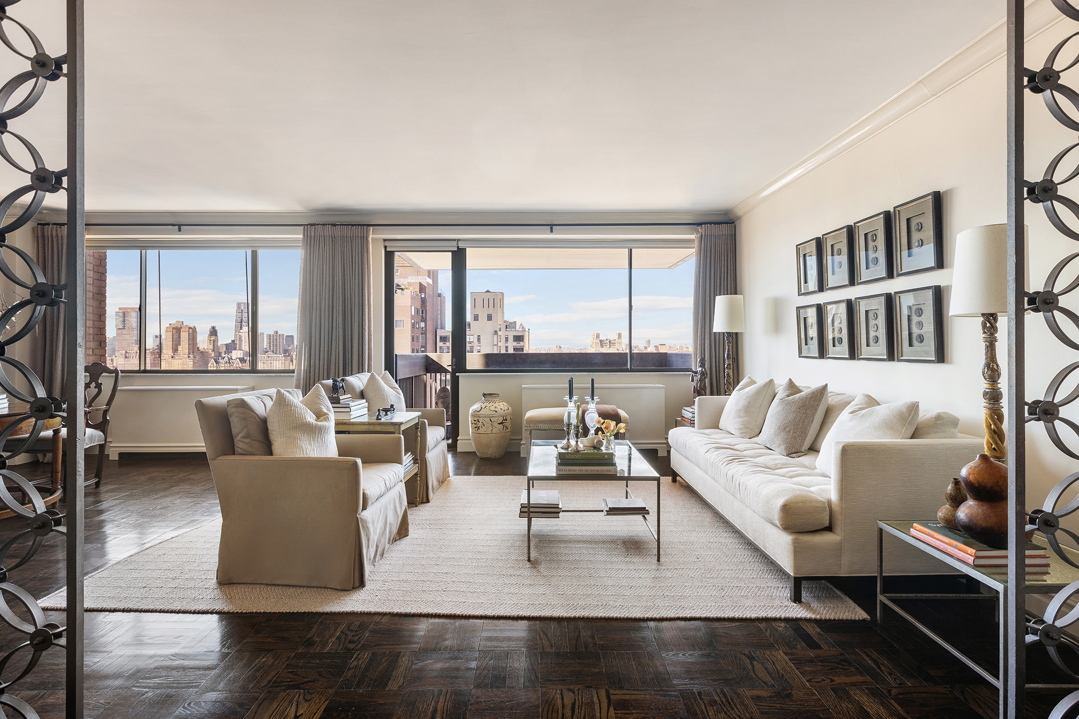 40 East 80th Street, Unit 24A Manhattan, NY 10075 - Photo 1 of 11 a living room with furniture and a large window