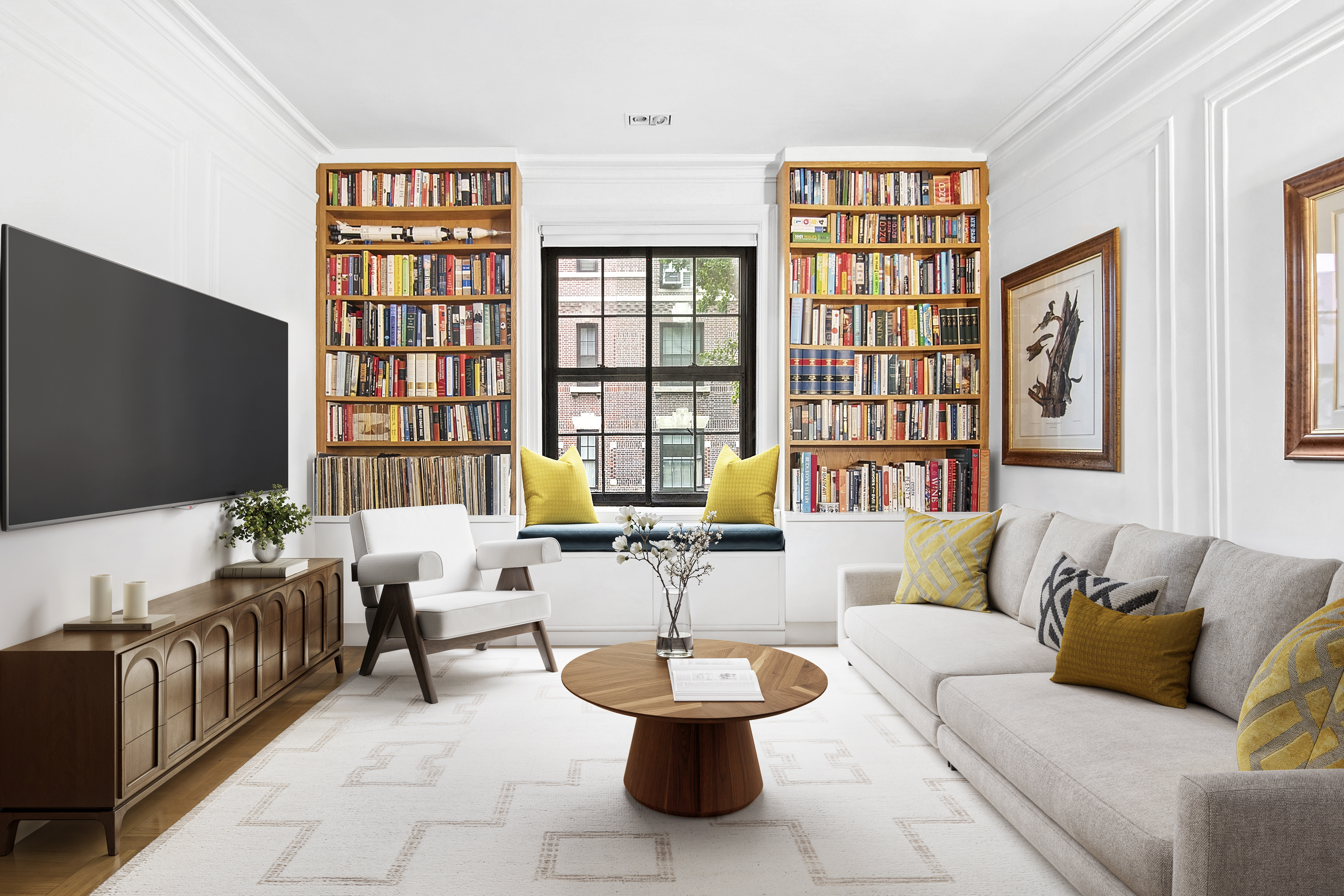 a living room with furniture and a flat screen tv