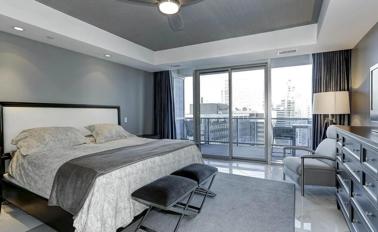 a bedroom with a bed and a couch