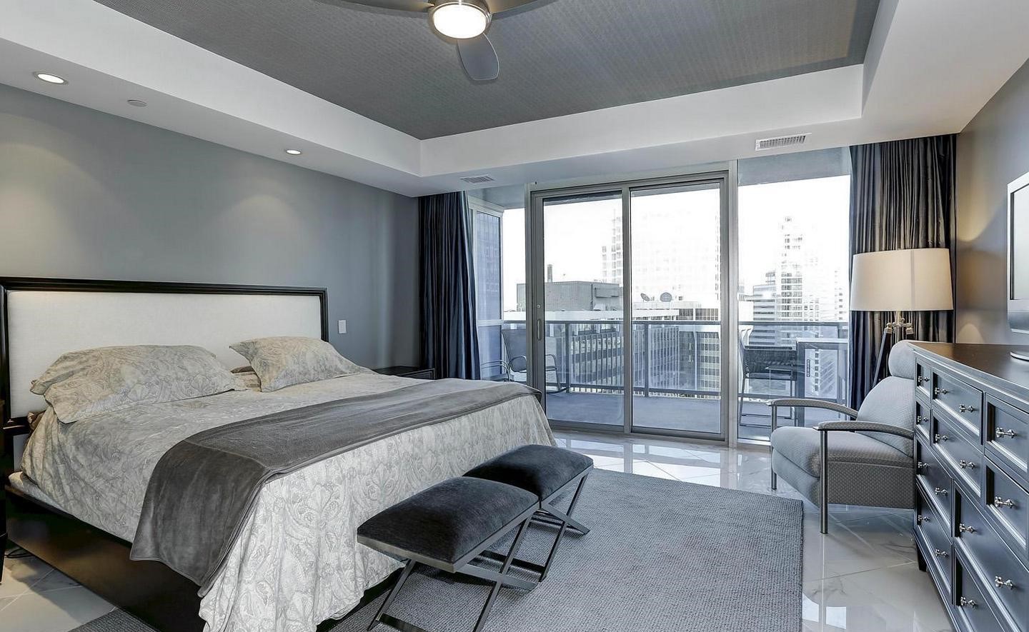 1881 North Nash Street, Unit 1009 Arlington, VA 22209 - Photo 10 of 36 a bedroom with a bed and a couch