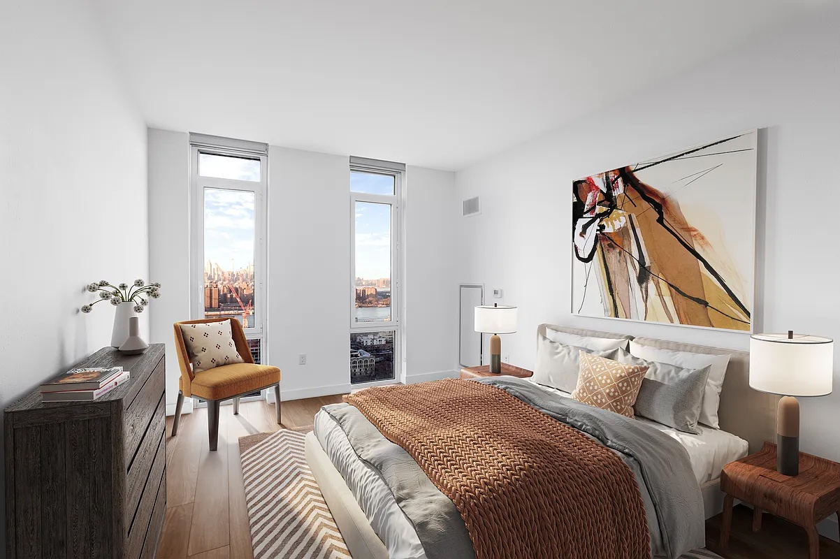 120 Nassau Street, Unit 10J Brooklyn, NY 11201 - Photo 4 of 11 a bedroom with a bed and a chair