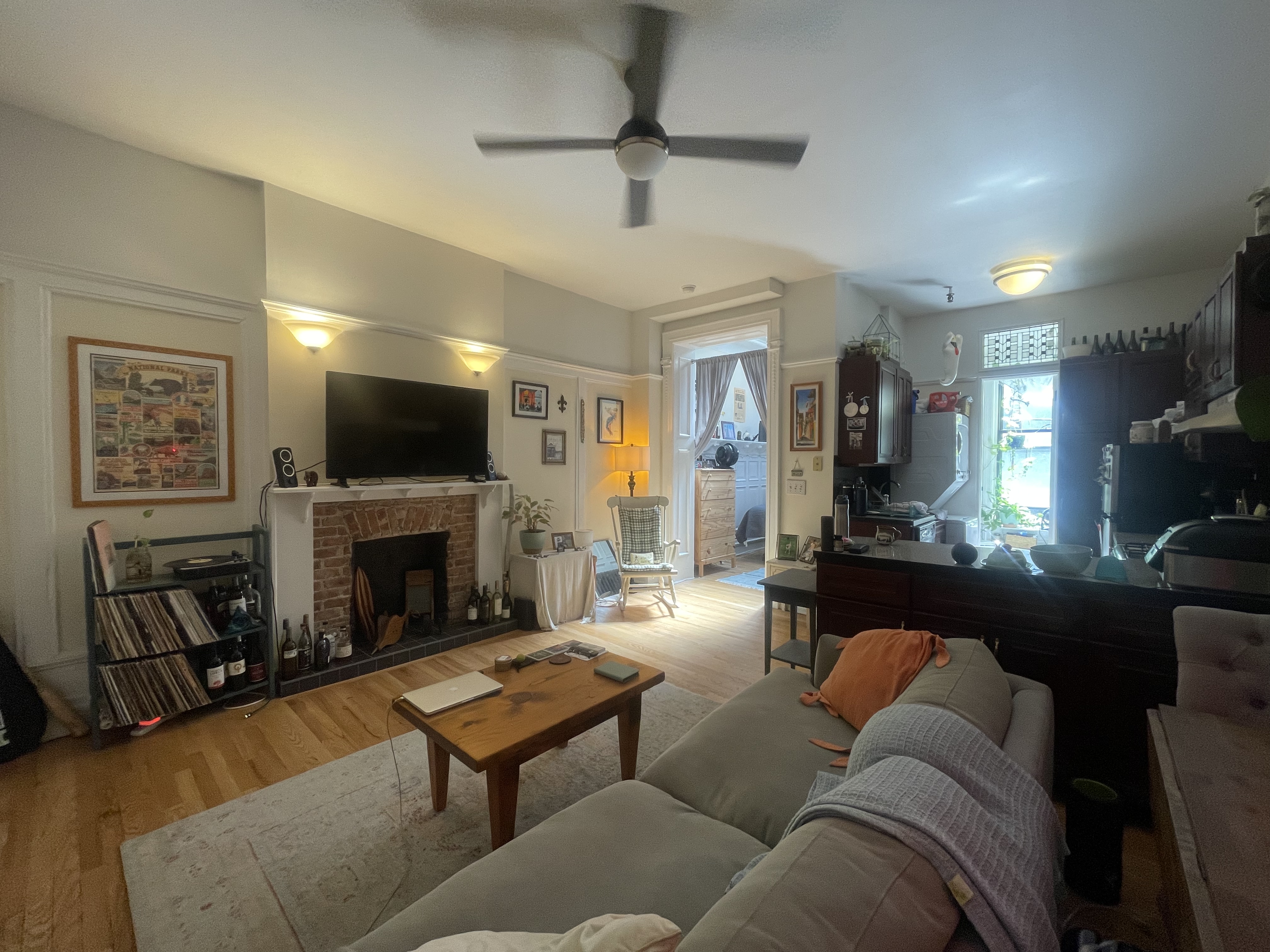 30 Montgomery Place, Unit 2 Brooklyn, NY 11215 - Photo 5 of 17 a living room with furniture a flat screen tv and a fireplace