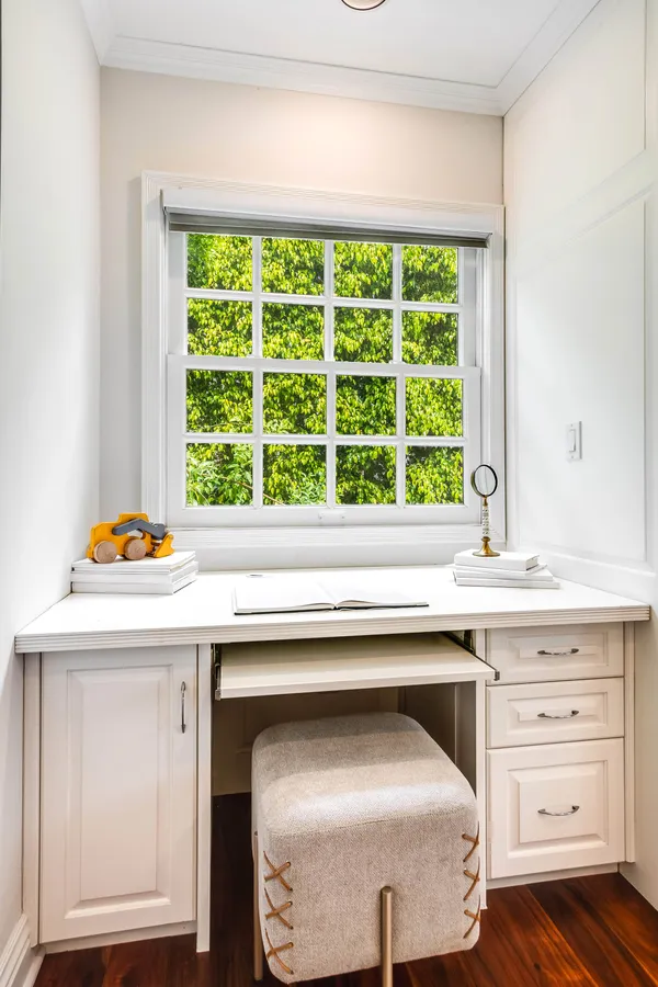 a kitchen with a sink and large window