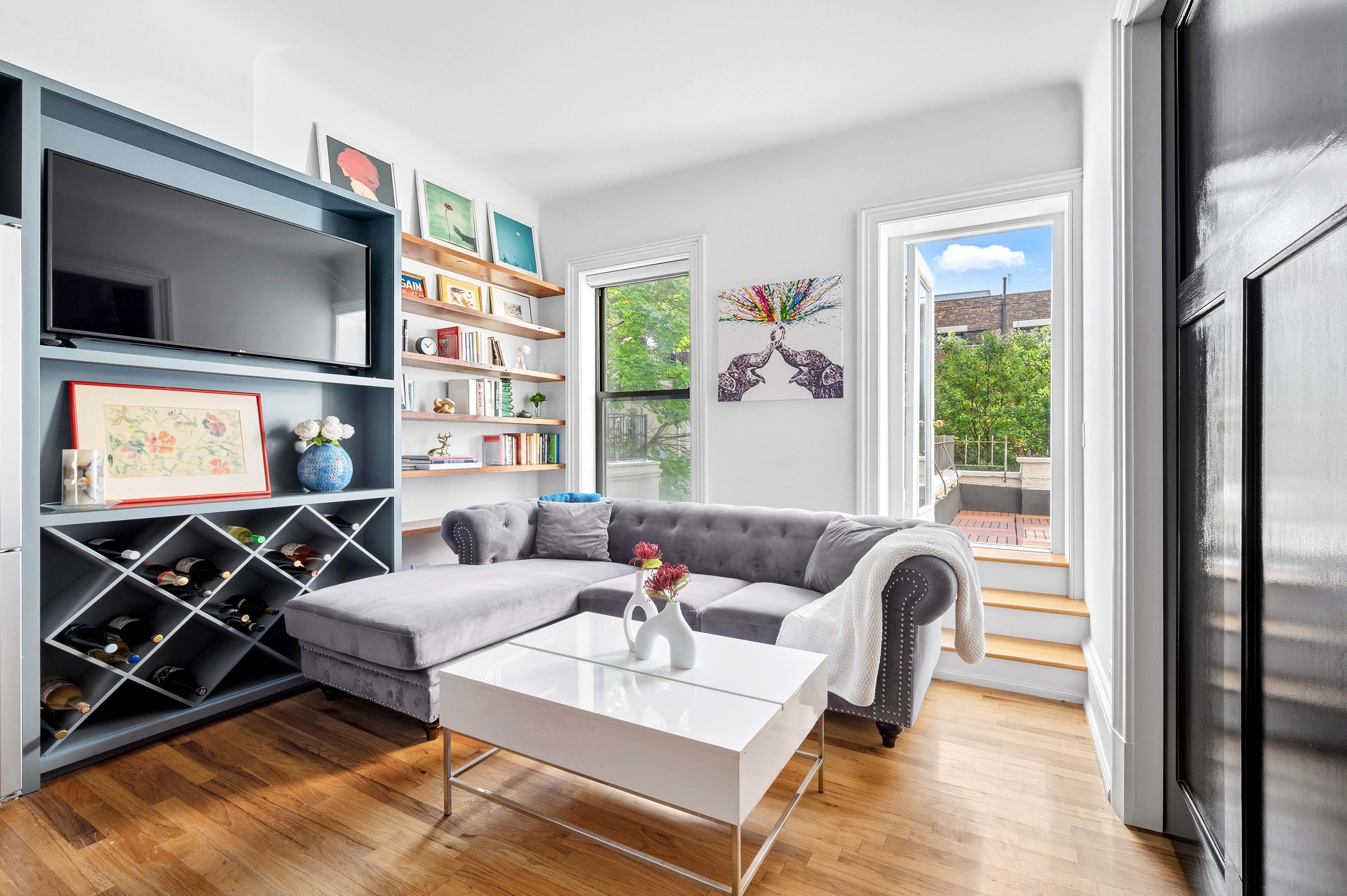 308 West 106th Street, Unit 4R Manhattan, NY 10025 - Photo 7 of 10 a living room with furniture and a flat screen tv