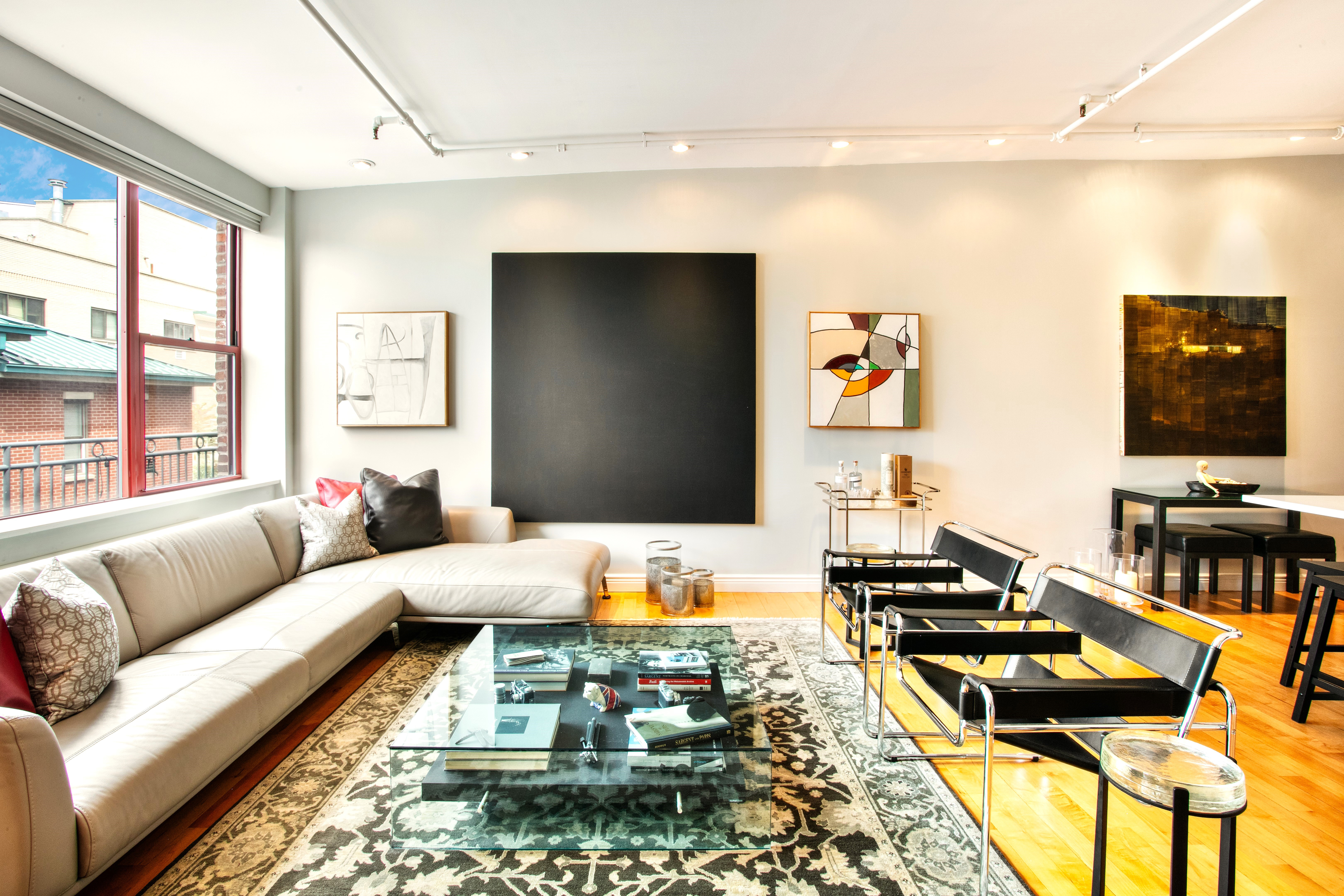 60 Tiffany Place, Unit 3C Brooklyn, NY 11231 - Photo 9 of 10 a living room with furniture and a flat screen tv