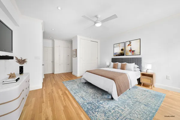 a bedroom with a bed and a dresser