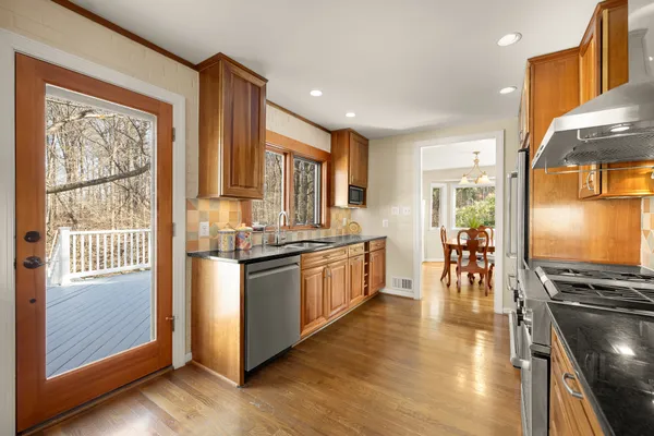 a view of a dining room with furniture and wooden floor