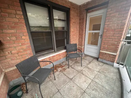 a view of a chairs and table in a porch