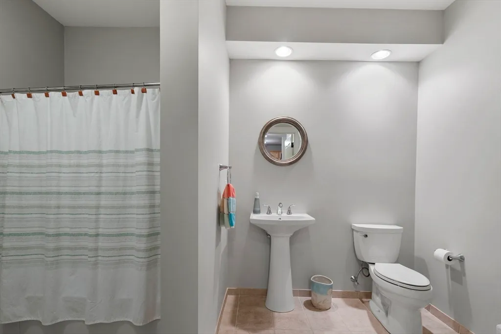a bathroom with a toilet and a sink
